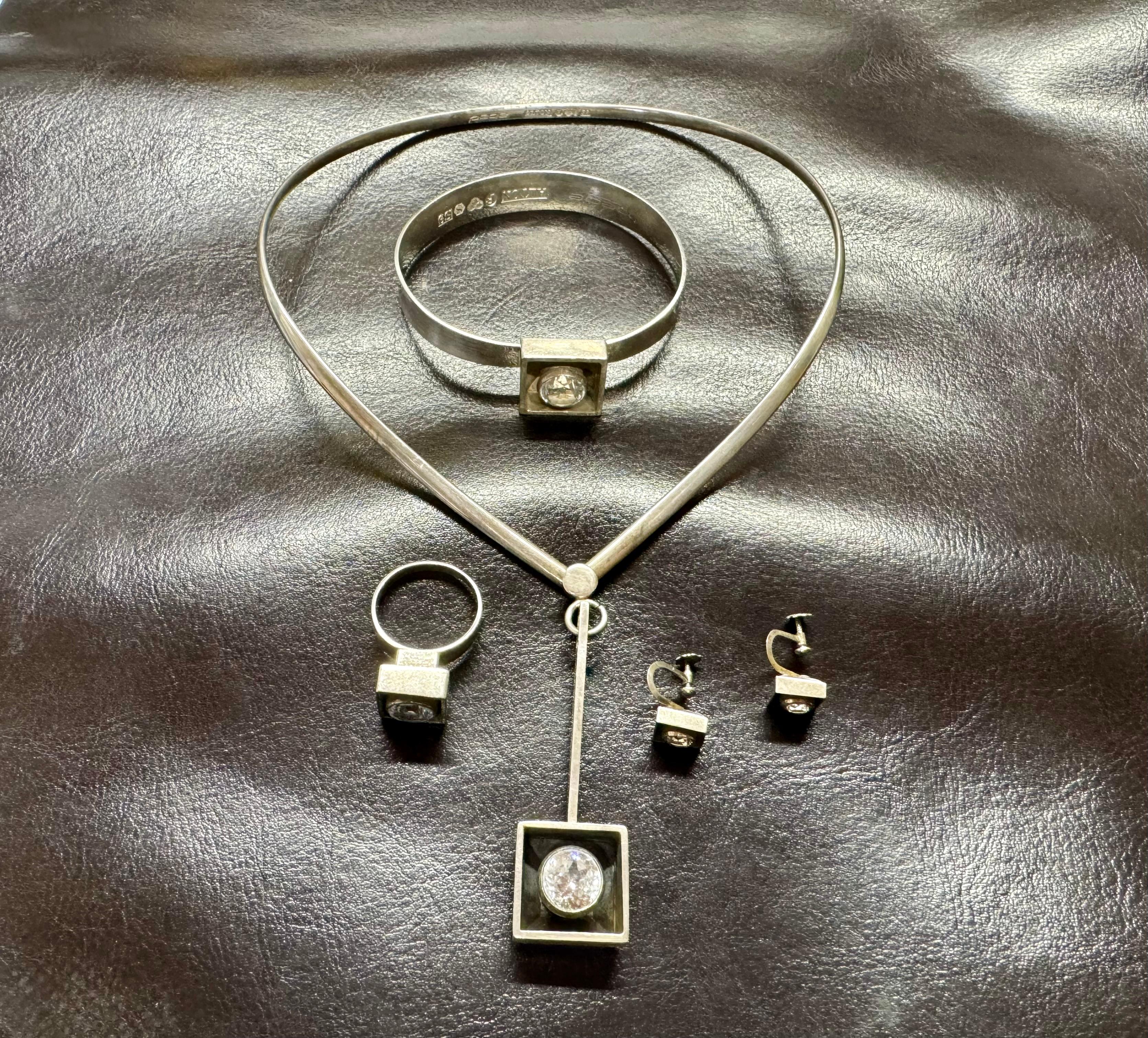Sterling Necklace, Bracelet, Ring and Earring Rock Crystal Scandinavian Desing
Made 1968 and 1969
Ring 19mm =US 9
Sterling silver modernist set. Alton Sweden. Stampes and Pege ALTON , S9 and T9 for 1968/1969 and Swedish silver marks.
Creator: Alton