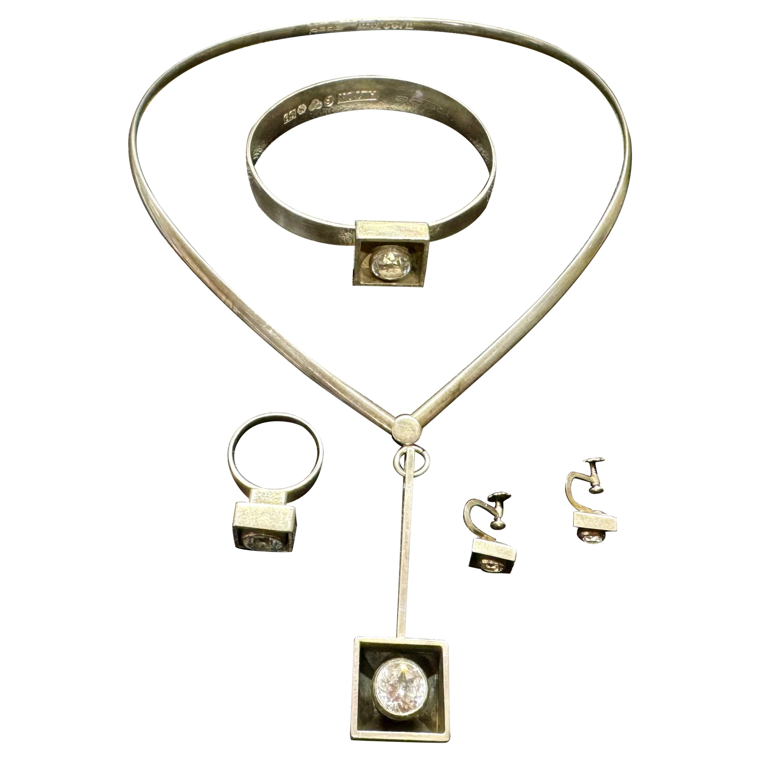 Collier, bracelet, bague et boucle d'oreille en cristal de roche au design scandinave