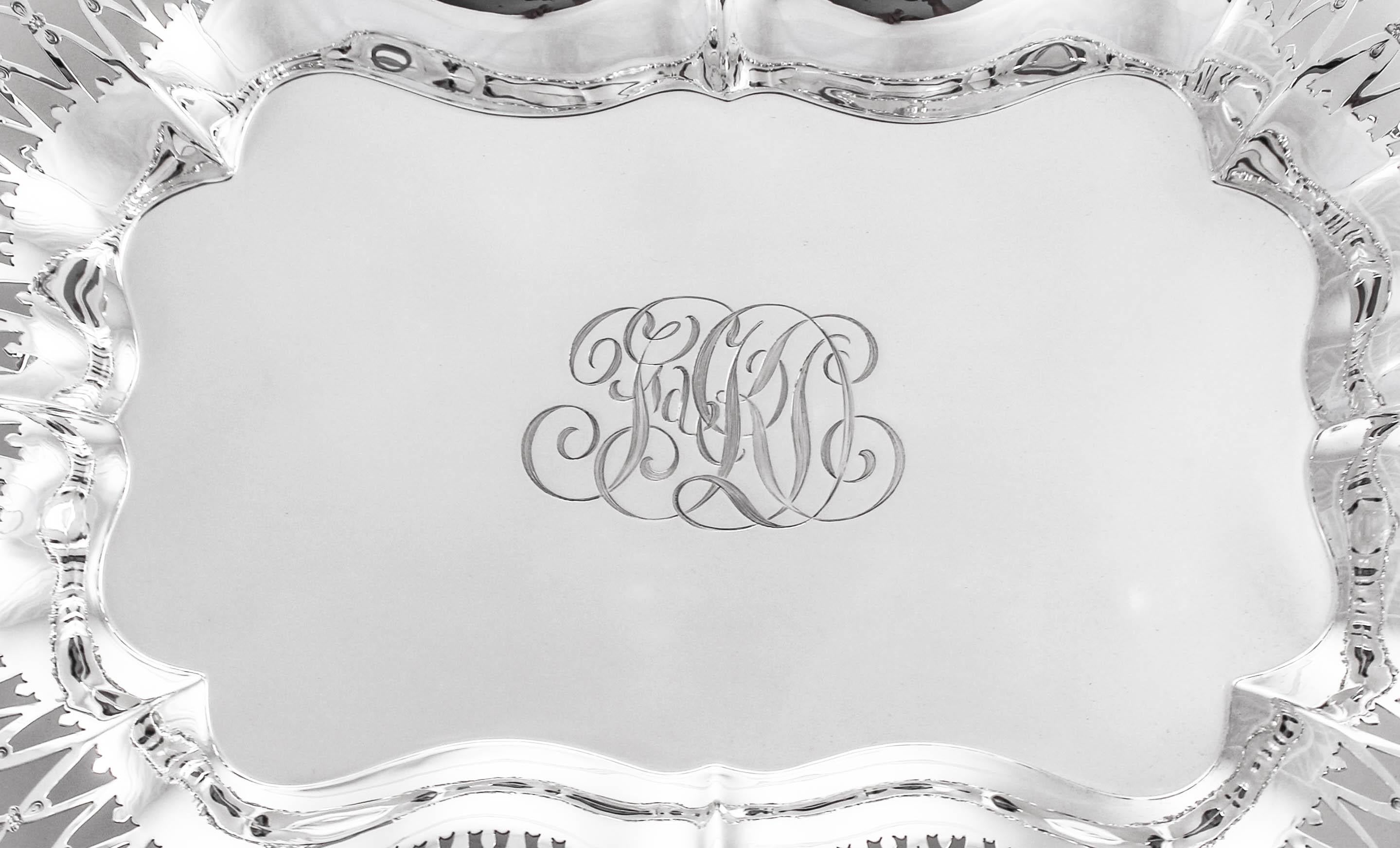 We proudly offer this sterling silver oblong tray by Black, Starr and Frost. It is reticulated and has an ornate rim that is also scalloped. In the center a hand engraved script monogram reminds you that although we’ve restored this piece to mint