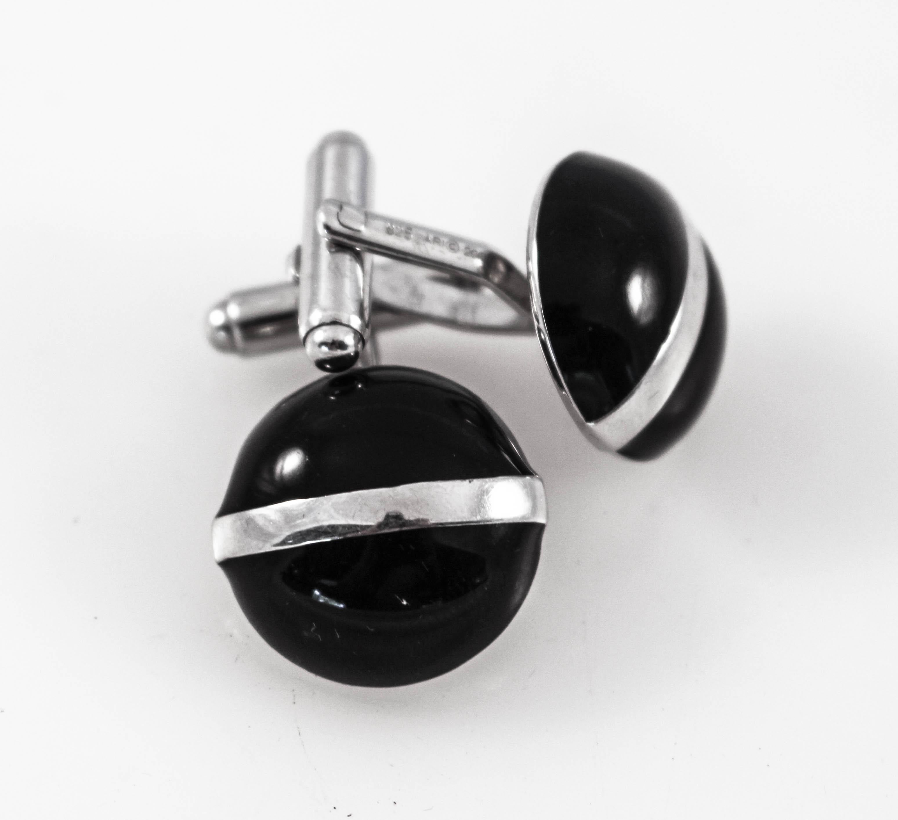 Just in time for Father’s Day and/or graduation, we are offering these sterling silver and onyx cufflinks. Made in England, they are black onyx with a silver stripe across the front. They are dressy and very chic. They can be worn with a suit or