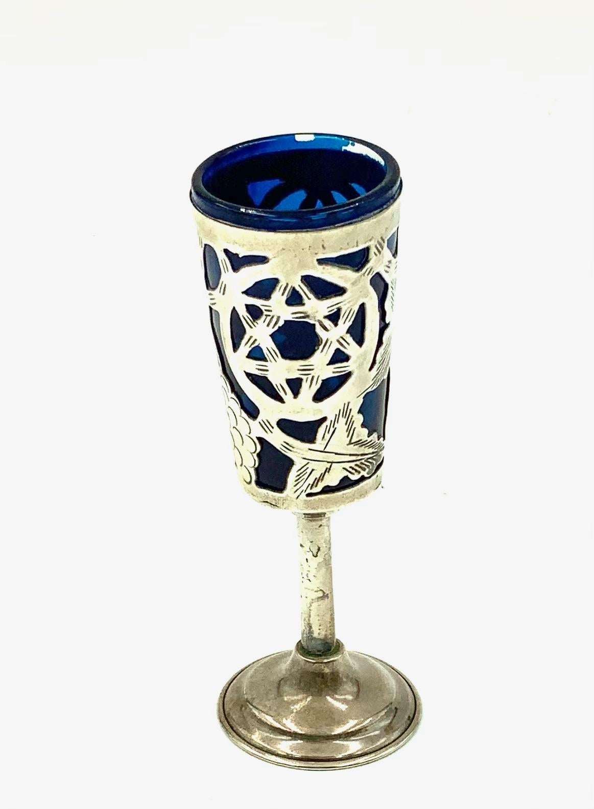 Rare set of 6 Mexican sterling overlay Judaica cordials or kiddish cups with blue painted glass inserts overlaid with engraved sterling grapes, leaves, vines and 2 star of David within a circle motifs on each glass. Marked along the underside