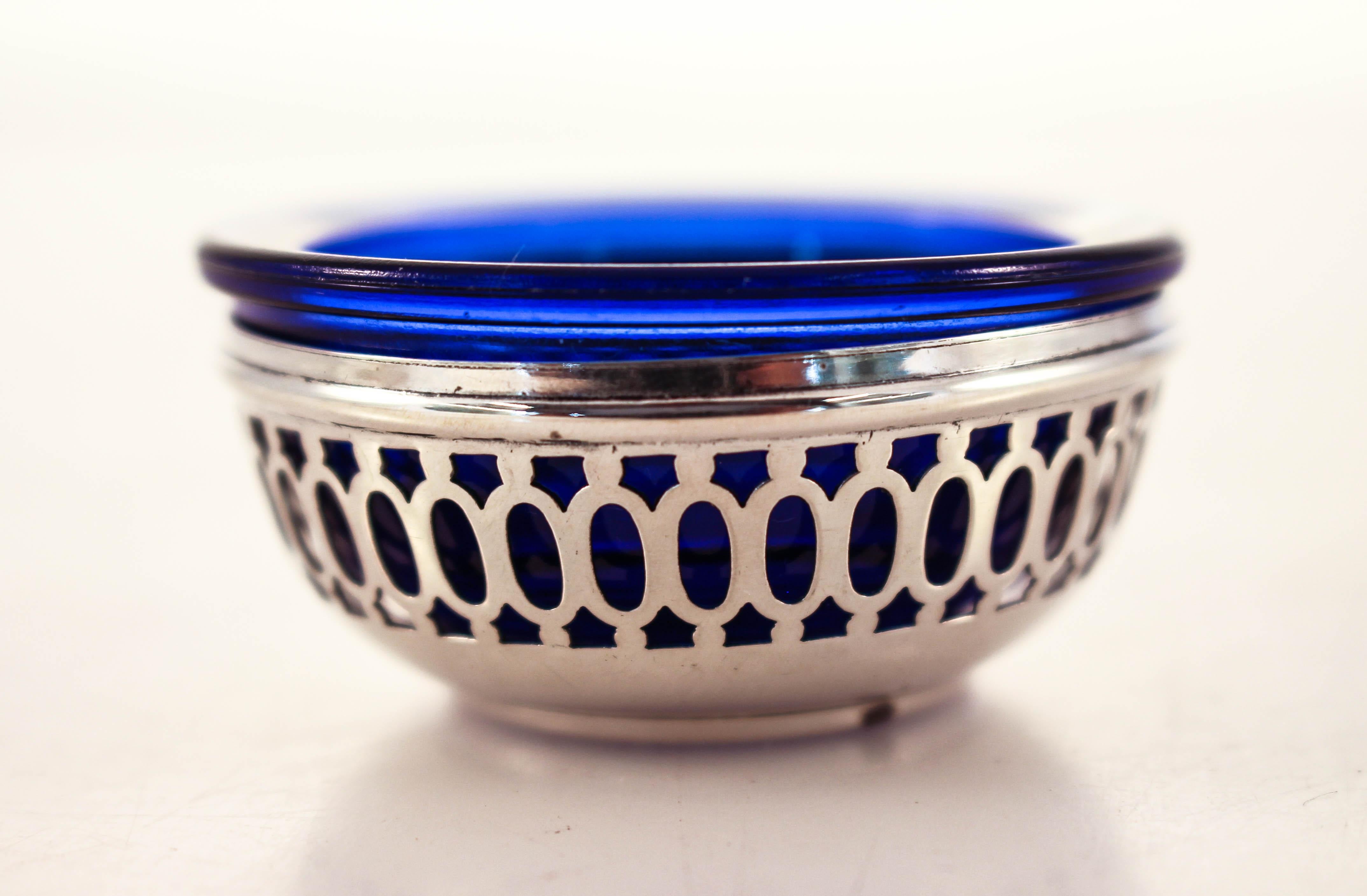 We are delighted to offer this sterling silver salt cellar with the original cobalt glass liner. The silver has a reticulated pattern that allows for the blue glass to come through. Easy to remove, wash and refill.