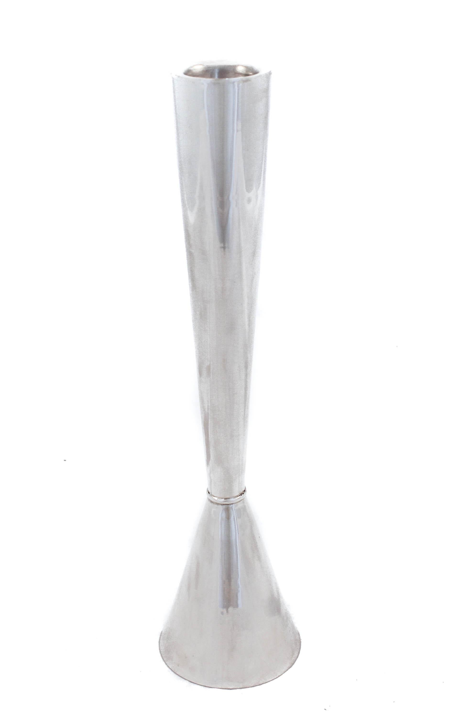 Being offered is a pair of new sterling silver candlesticks. They are uber-modern and sleek and will look gorgeous in a contemporary setting. They have a cone shape and are not weighted. Perfect for a young newlywed couple.