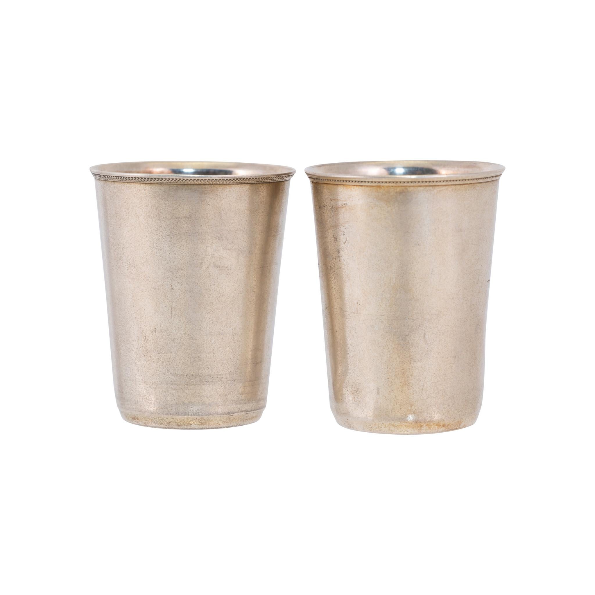 Matched pair Russian engraved sterling shot glasses.

PERIOD: Last quarter 19th Century
ORIGIN: United States
SIZE: 1 1/25