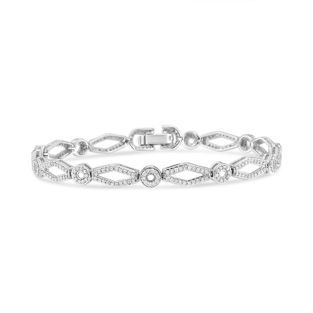 Dress her wrist in luxury with this enticing vintage-inspired diamond bracelet. Crafted in cool weaves of .925 sterling silver, this shimmering design features alternating circle and kite-shaped links that sparkle with diamonds and are lined with