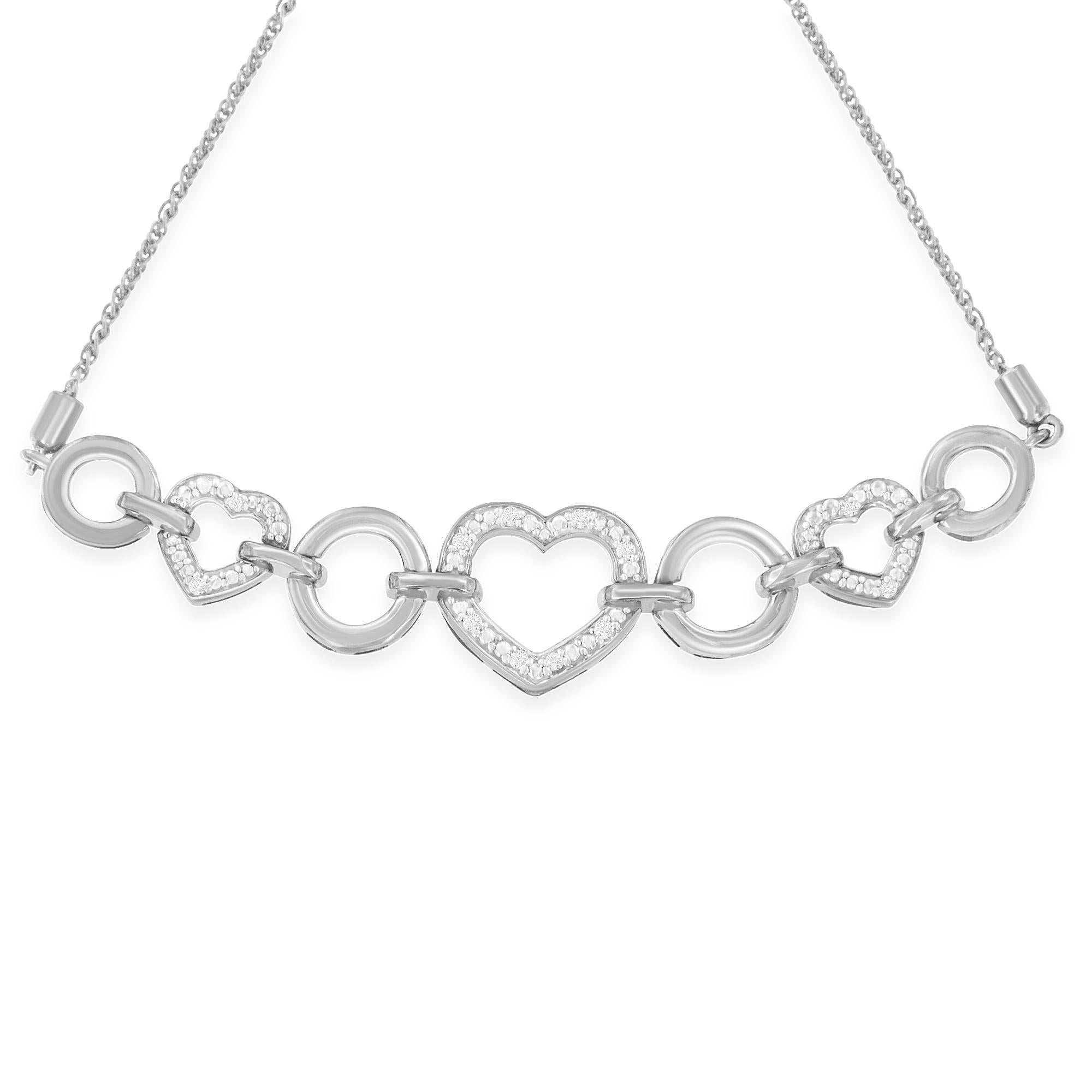 Stay on trend with this alluring chain bracelet. It is crafted of sterling silver and features interlocking heart and infinity accents that are adorned with sparkling round cut diamonds. This modern bracelet makes a perfect Valentine's Day gift, or