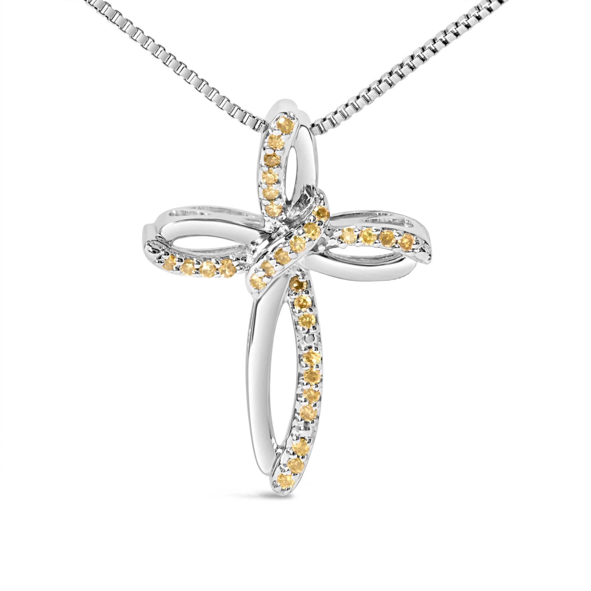 Elegati nella divina eleganza di questa collana in argento 925 rodiato, dove il simbolo spirituale incontra l'arte moderna in un ipnotico ciondolo a forma di nastro e croce. Ogni giro del nastro cattura la luce, esaltata dal bagliore dorato dei