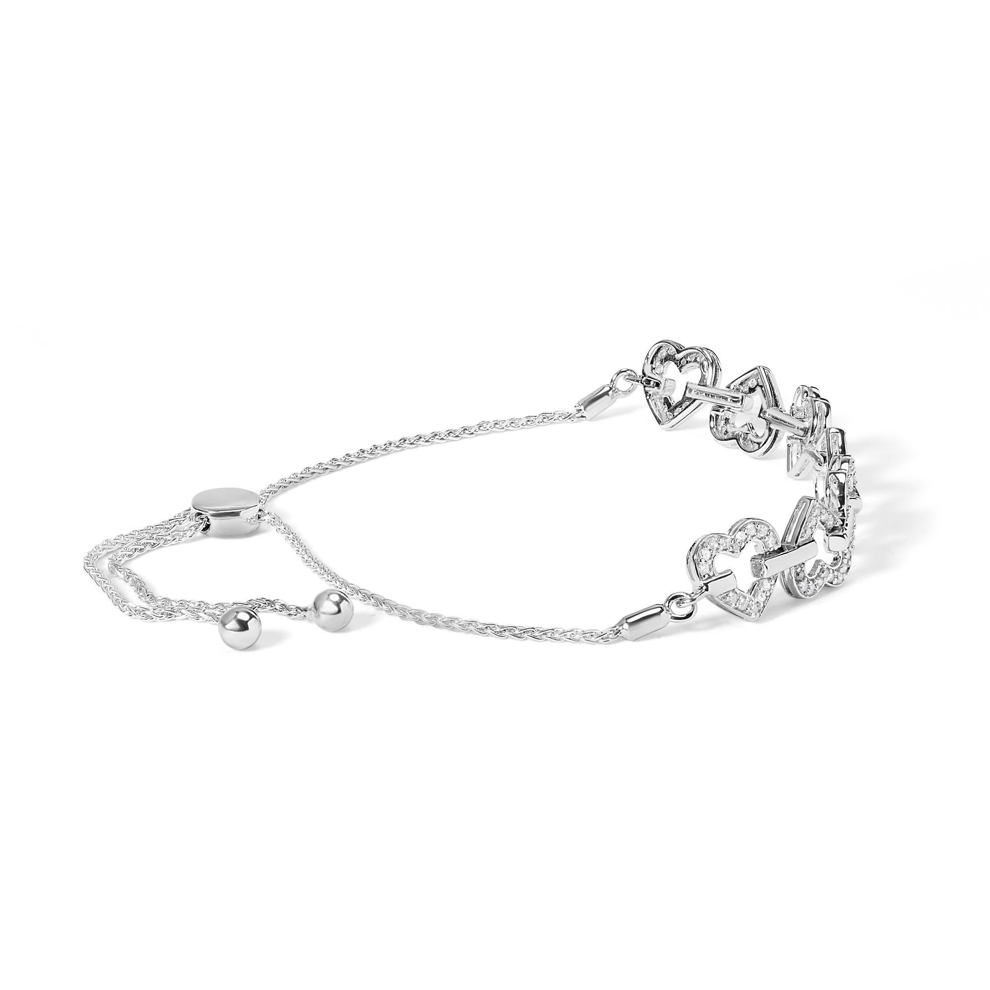 Laissez-vous séduire par le romantisme luxueux du bracelet Bolo en argent sterling .925, un chef-d'œuvre conçu pour capturer les cœurs avec ses diamants naturels scintillants, totalisant 1/2 Cttw, nichés dans une danse délicate de maillons en forme