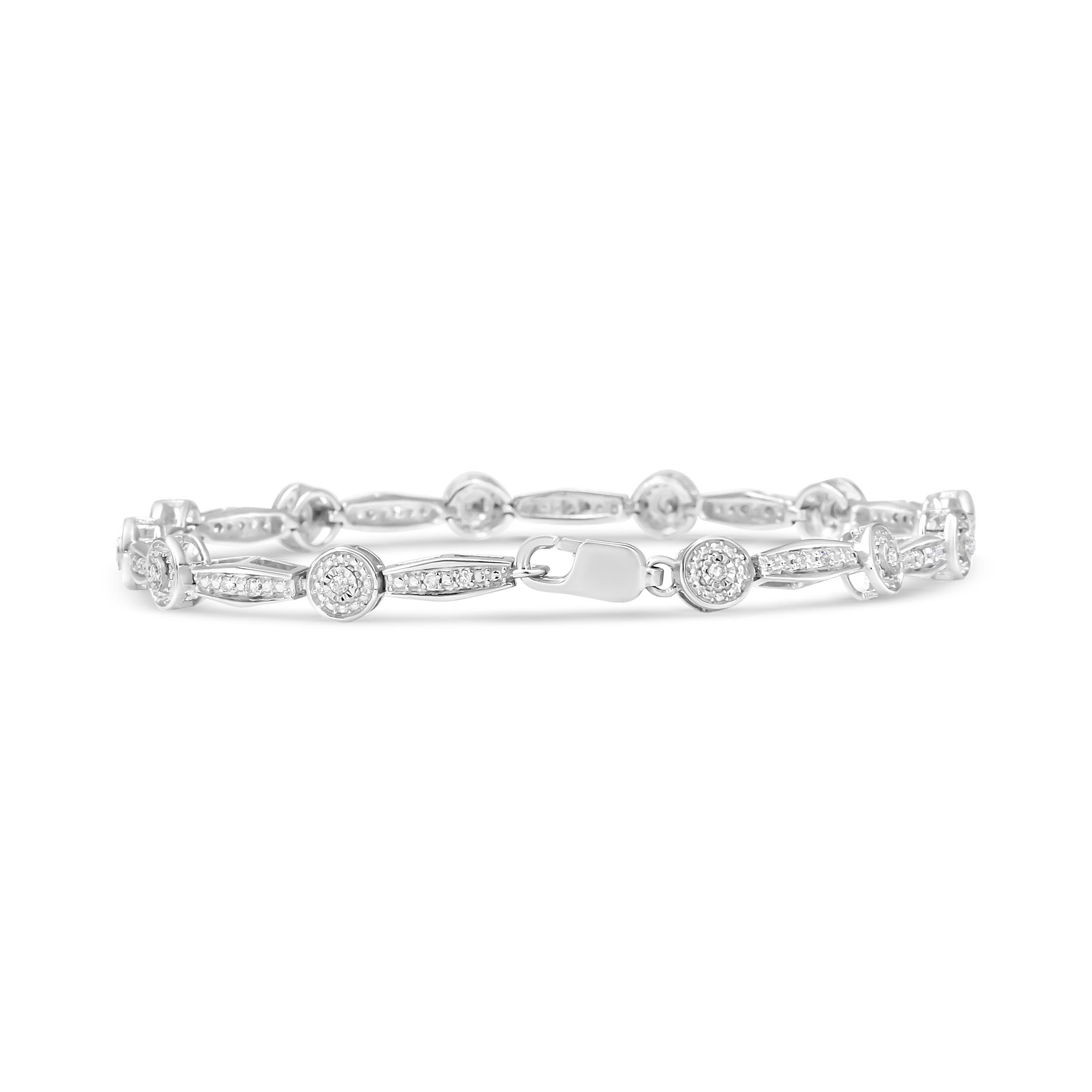 Showcasing a stunning link pattern studded with round white diamonds, this .925 sterling silver bracelet instantly adds a pop of sparkle to any ensemble. Stunning centerpiece diamonds are beautifully embellished in a stone enhancing miracle plate
