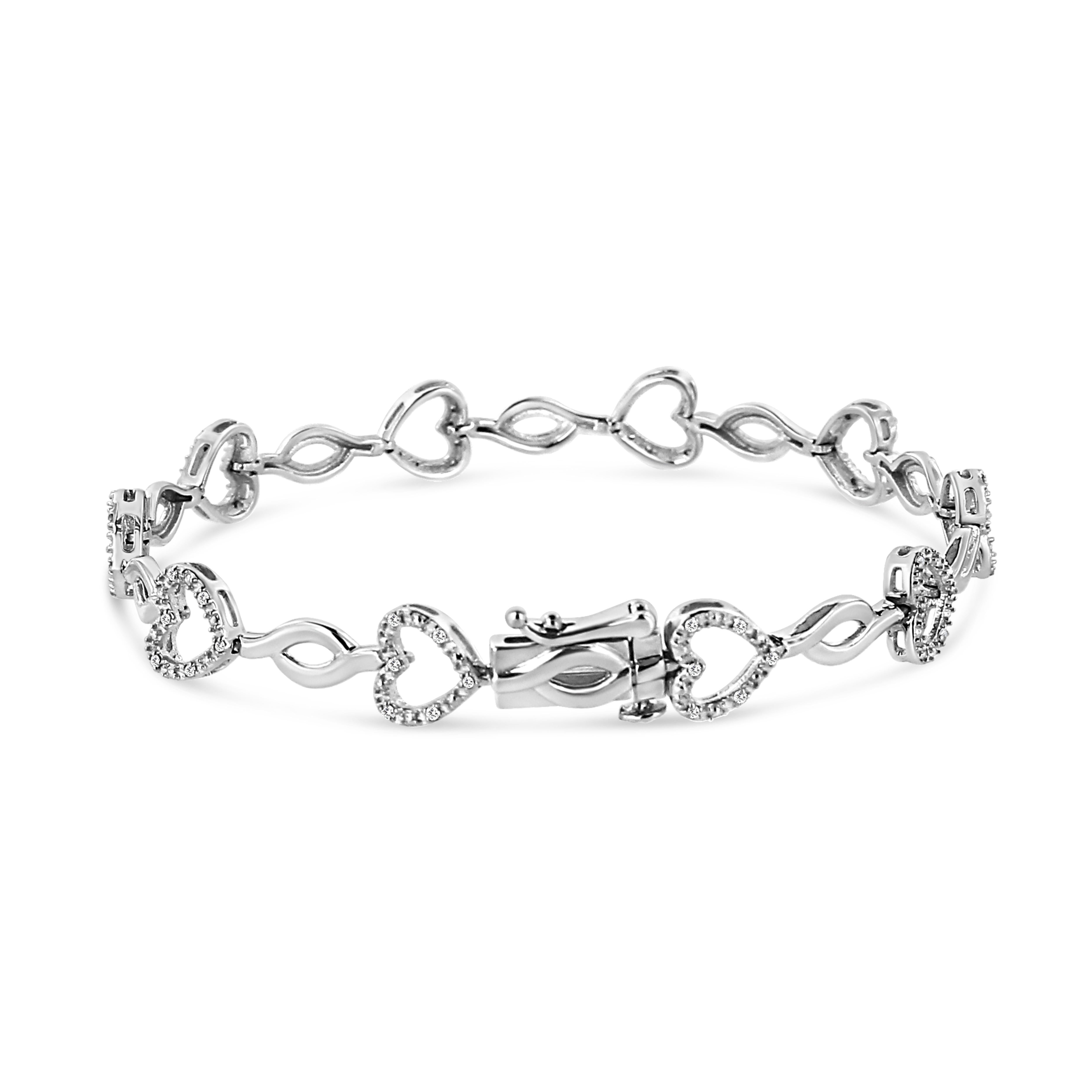 Shine bright this season with this trendy silver bracelet with elegant heart and infinity links. This piece is crafted in the finest .925 sterling silver, plated with rhodium (a platinum-family metal) for a lifetime of tarnish-free wear. The