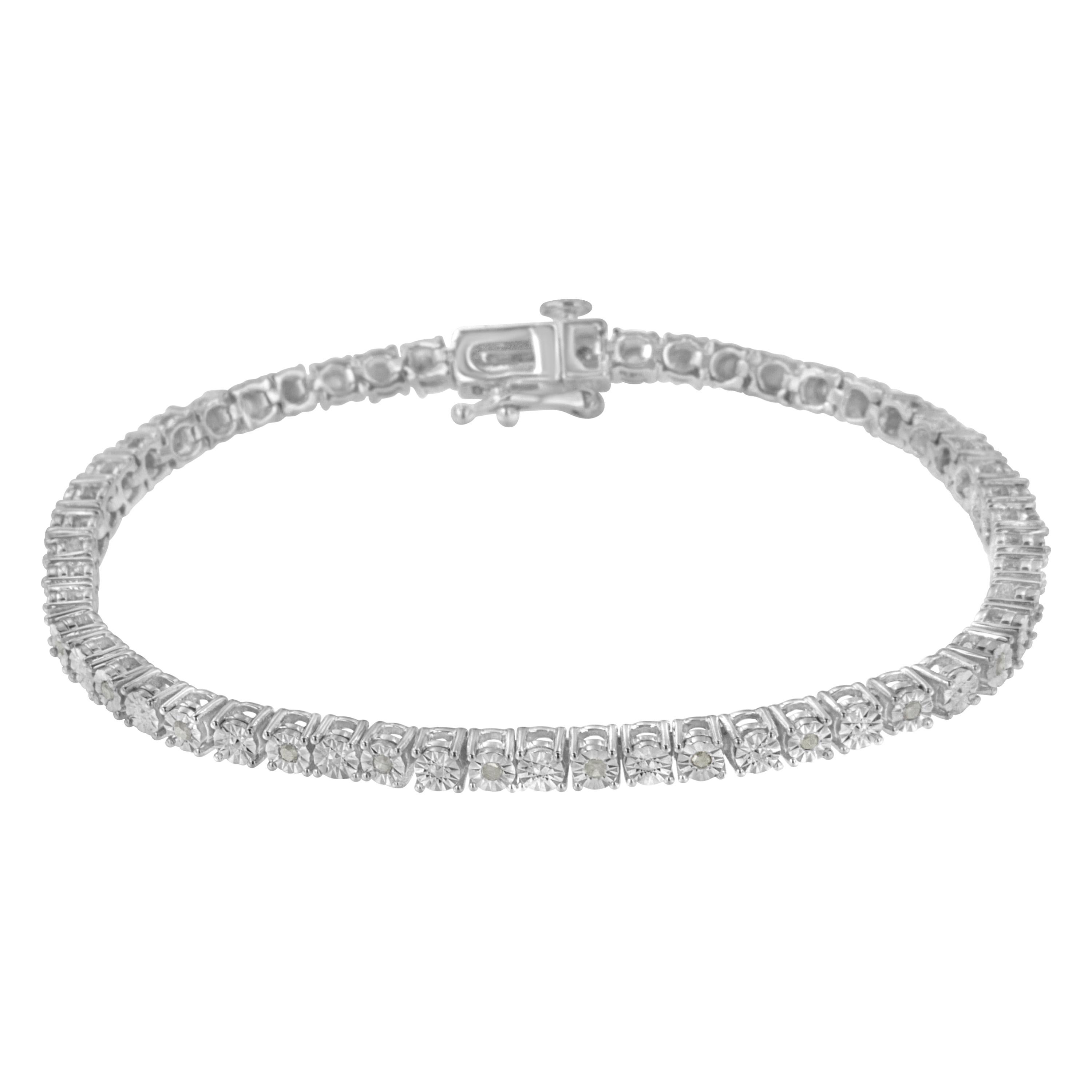 Elegant and timeless, this gorgeous pure 92.5% sterling silver tennis bracelet features 1/4 carat total weight of round diamonds. The bracelet features unique illusion-settings with miracle-plates that center each genuine diamond in a mirror-finish,