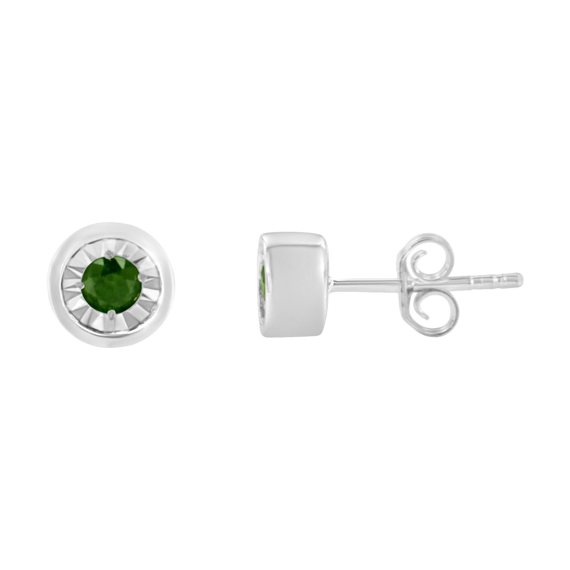 This delicate pair of diamond stud earrings feature color treated green diamonds. Crafted in a cool sterling silver making them the perfect choice to add a touch of color to everyday wear. The total diamond weight is .2 carats. 

'Video Available