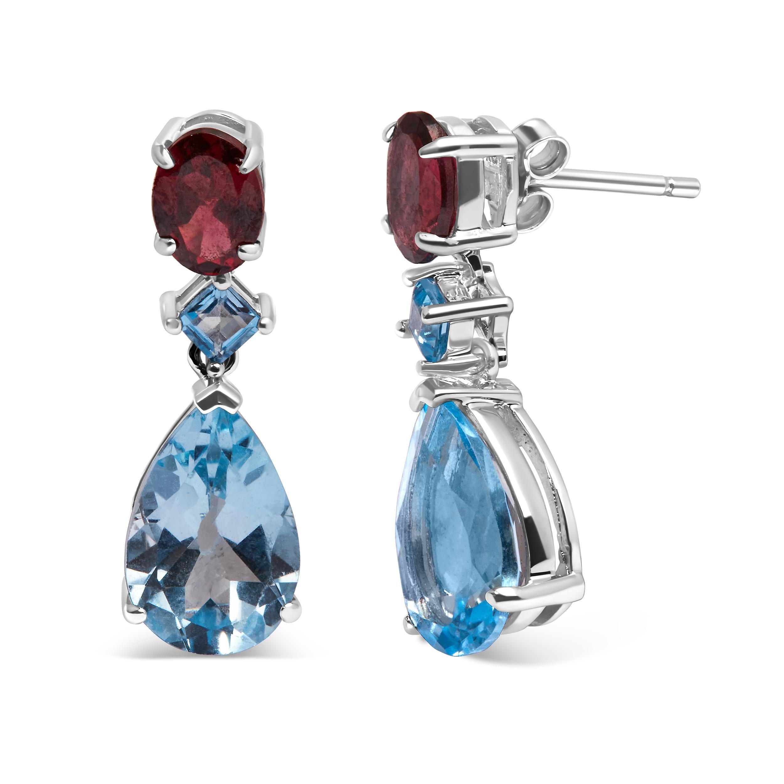 Indulge in the enchanting allure of these exquisite dangle drop earrings. Crafted with .925 sterling silver, these earrings showcase a mesmerizing 10.0 carat blue topaz and grape rhodolite garnet gemstone duo. The pear-shaped blue topaz, square blue