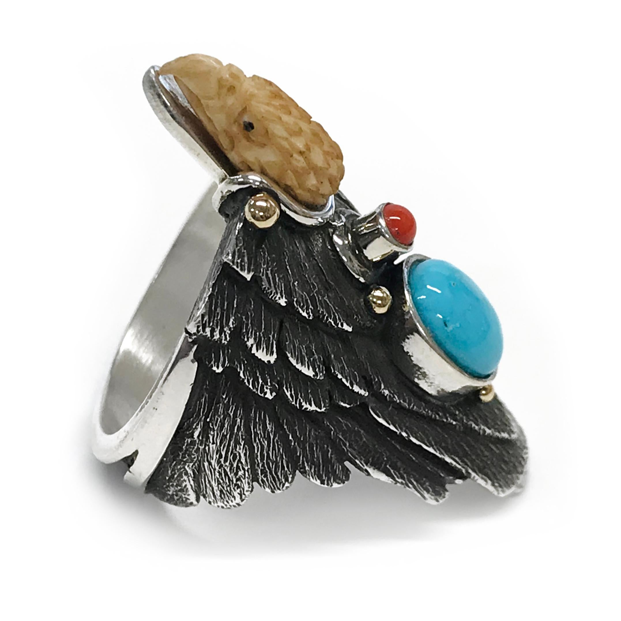 Handcrafted from Sterling Silver with 14k accents by jewelry maker, Ray Winner. This absolutely glorious ring features a natural Kingman Turquoise oval cabochon and Mediterranean Coral round cabochon bezel set. The form of the ring band is created