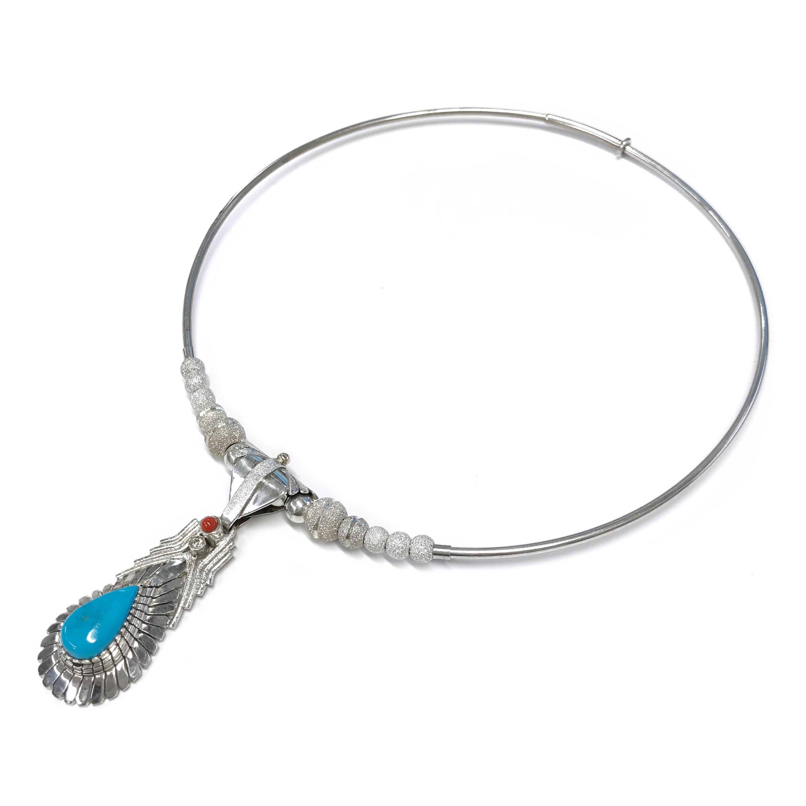 Handcrafted from a sterling silver sheet by jewelry maker, Ray Winner. The choker necklace consists of four smaller silver beads with ten graduate stone finish silver beads on silver wire with plunger closure. The pendant features a pearl-shaped