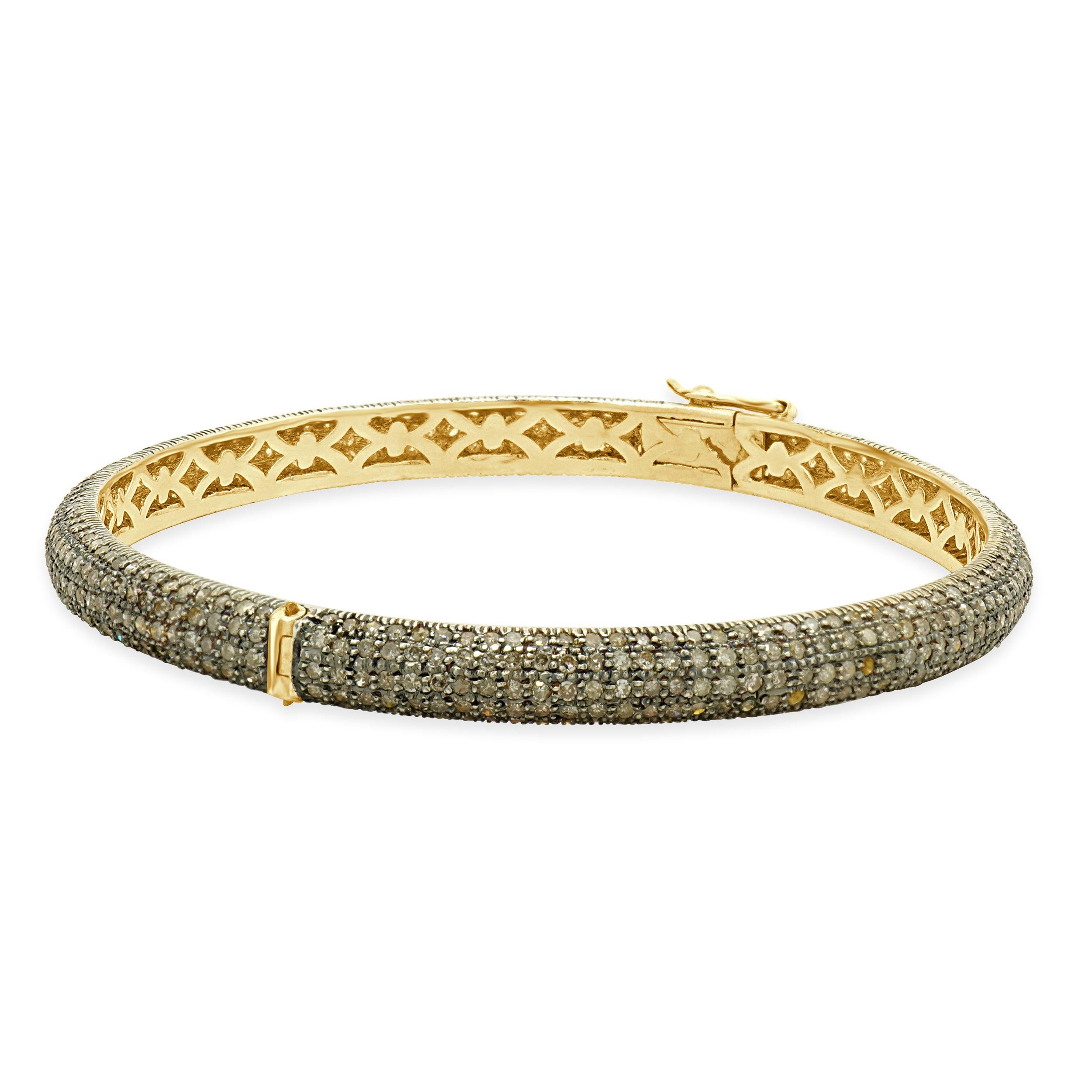 Designer: custom design
Material: sterling silver & 14K yellow gold
Diamond: round brilliant cut = 3.00cttw
Dimensions: bracelet will fit up to a 7.75-inch wrist
Weight: 14.33 grams

