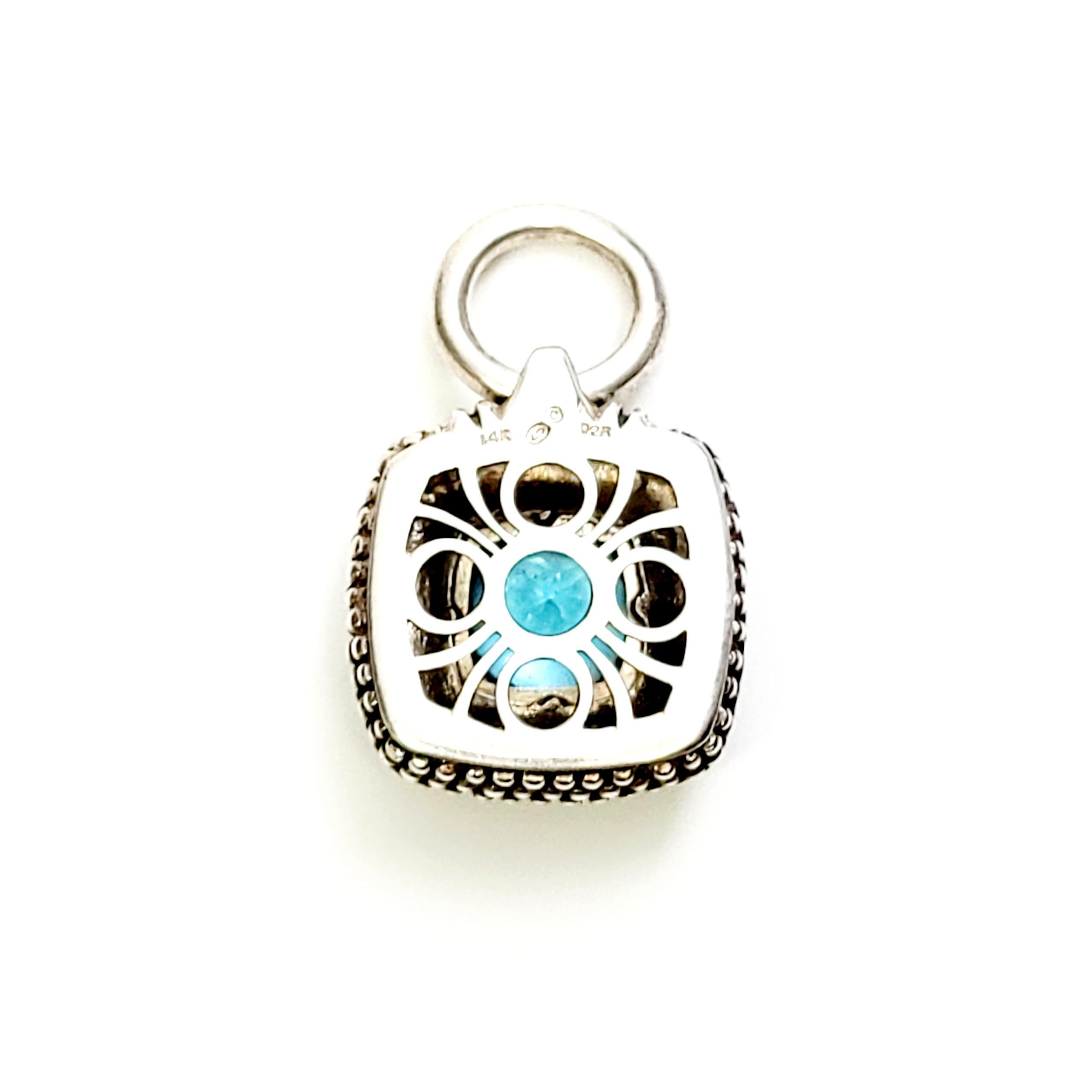 Sterling silver and 14K blue topaz pendant.

This beautiful square sterling silver caviar style pendant features a square blue topaz bezel set in a 14K yellow gold bezel.

Measures approx 1 3/4