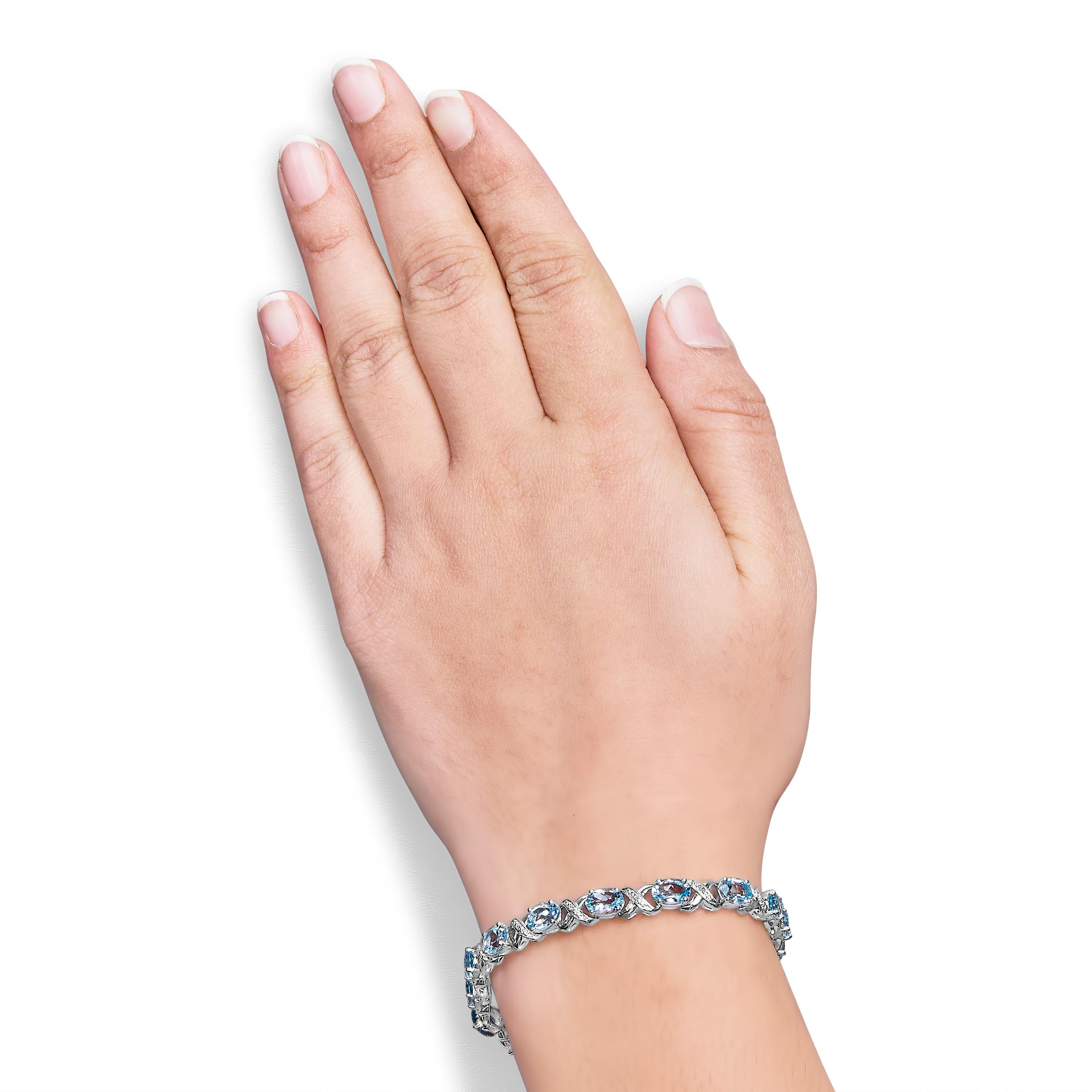 Sterling Silver 16.0ct Oval Blue Topaz and Diamond Accent Tennis X Link Bracelet In New Condition For Sale In New York, NY