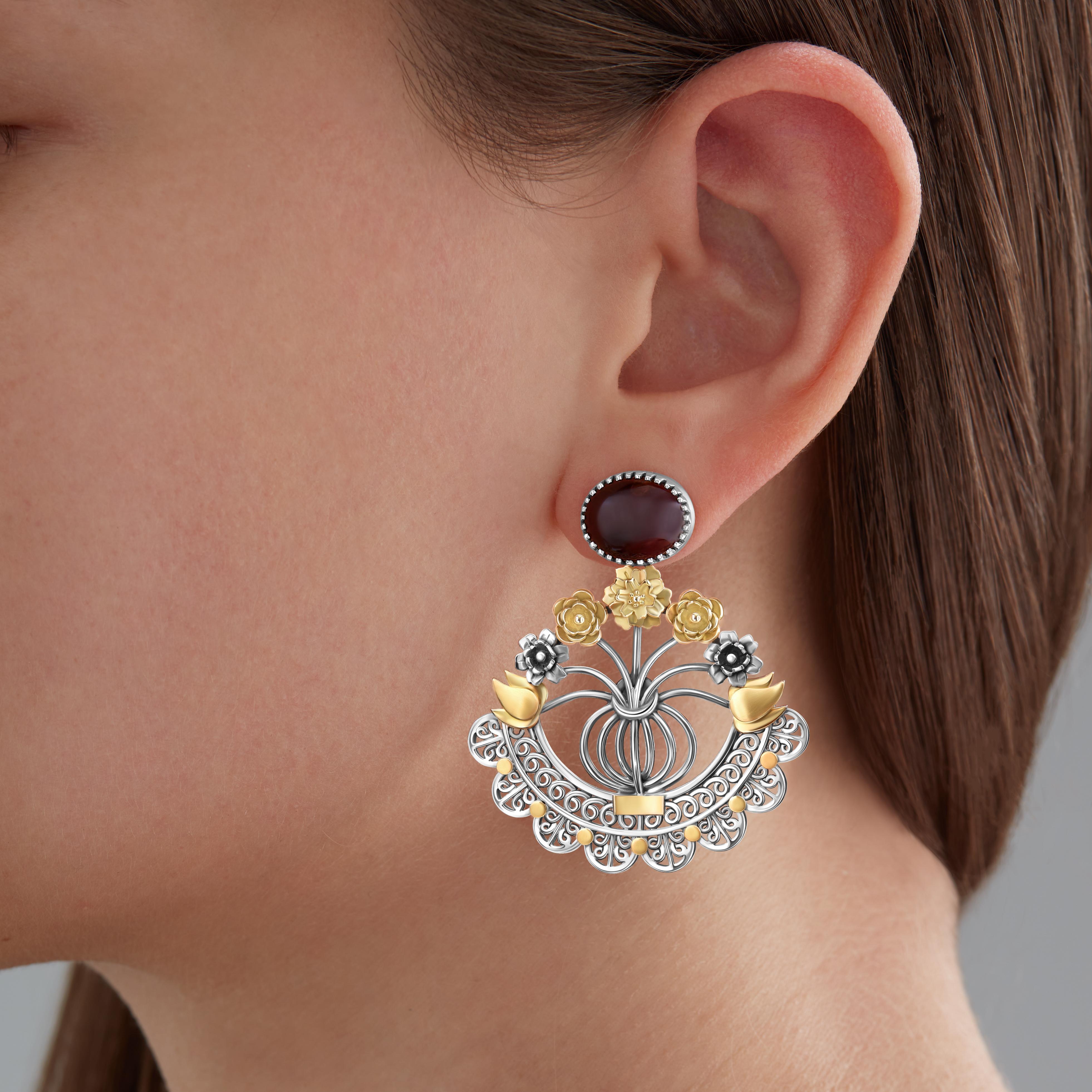 Sterling Silver, 18 Karat Gold and Cabouchon Red Tourmaline Floral Bouquet Statement Earrings featuring one-of-a-kind stones that are unique in colour, shape and size. Making each pair distinct, no two pairs are alike. The vase-like design swings