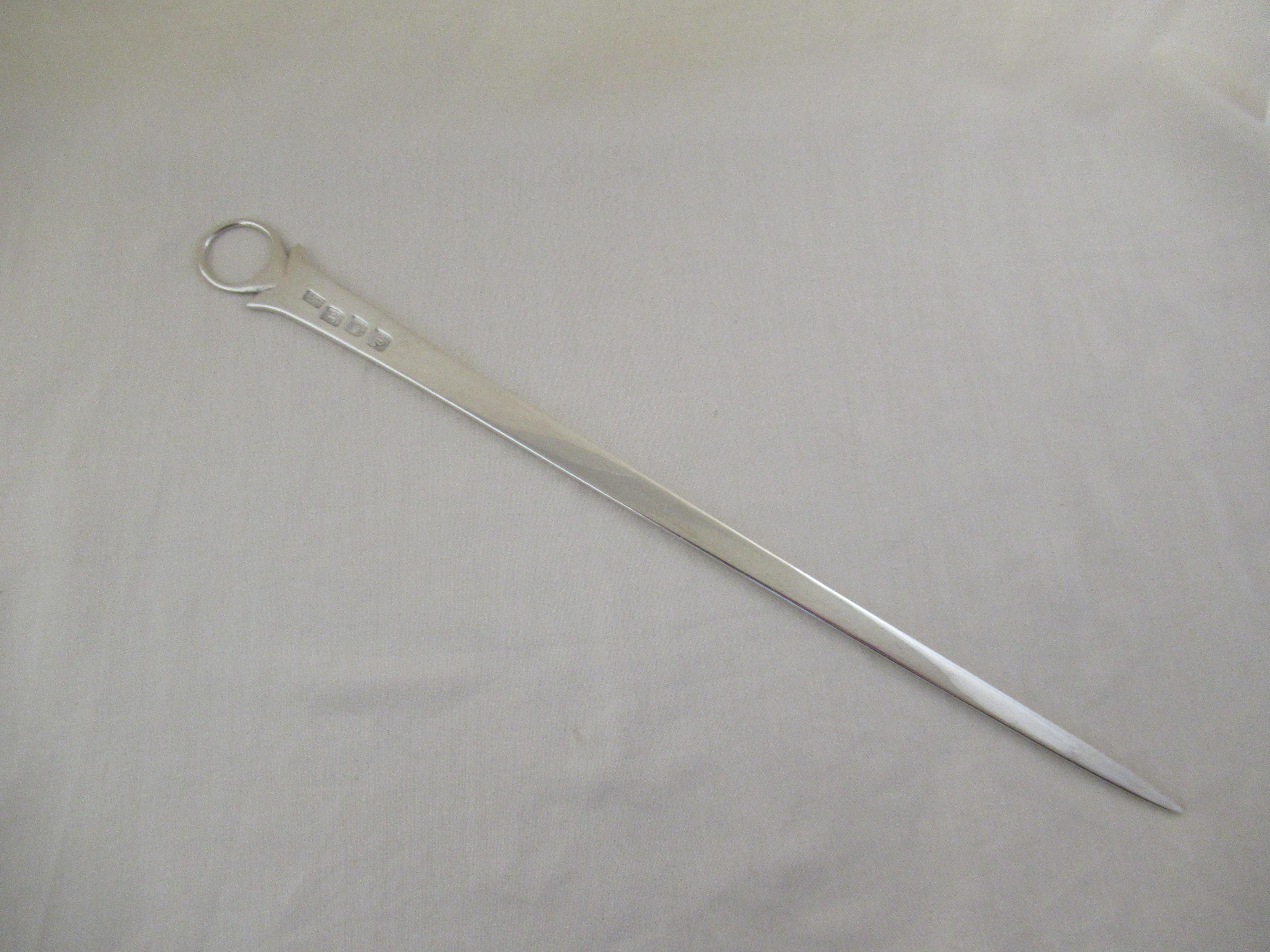 Sterling silver George II meat skewer / paper knife.
A superb set of hallmarks applied by the London Assay Office:-
 Lion - sterling silver guarantee mark
 Leopard`s head - London Assay Office mark.
 Letter C - Date mark for London 1758
 W.C -