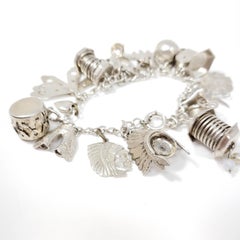 Sterling Silver 19 Charm Assortment Chain Bracelet, Mid 1900s, Mexico