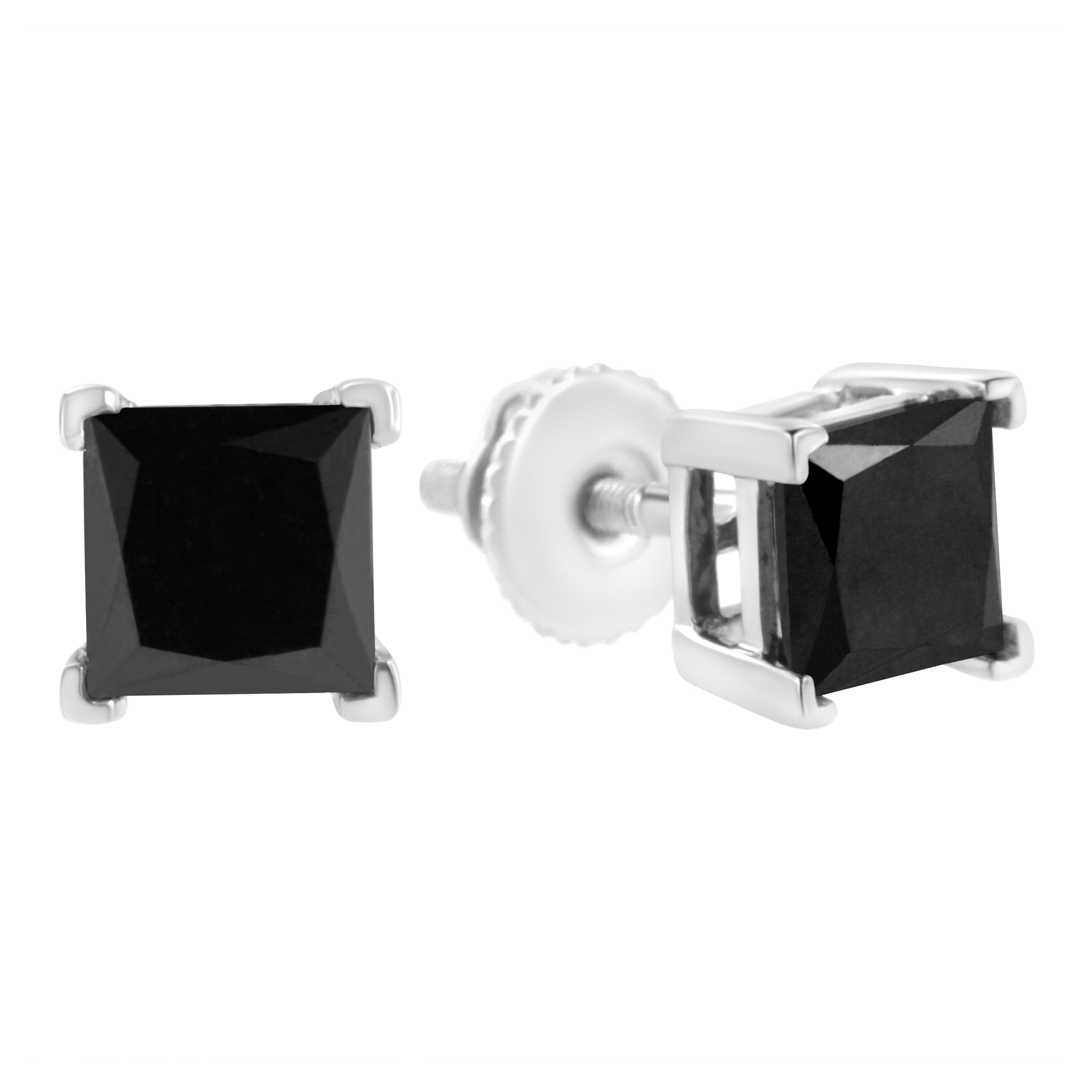 Elegant and timeless, these gorgeous .925 sterling silver solitaire stud earrings feature bold and beautiful heat treated, color enhanced black diamonds in a four prong setting. The earrings feature screwback closures. The notched posts and friction