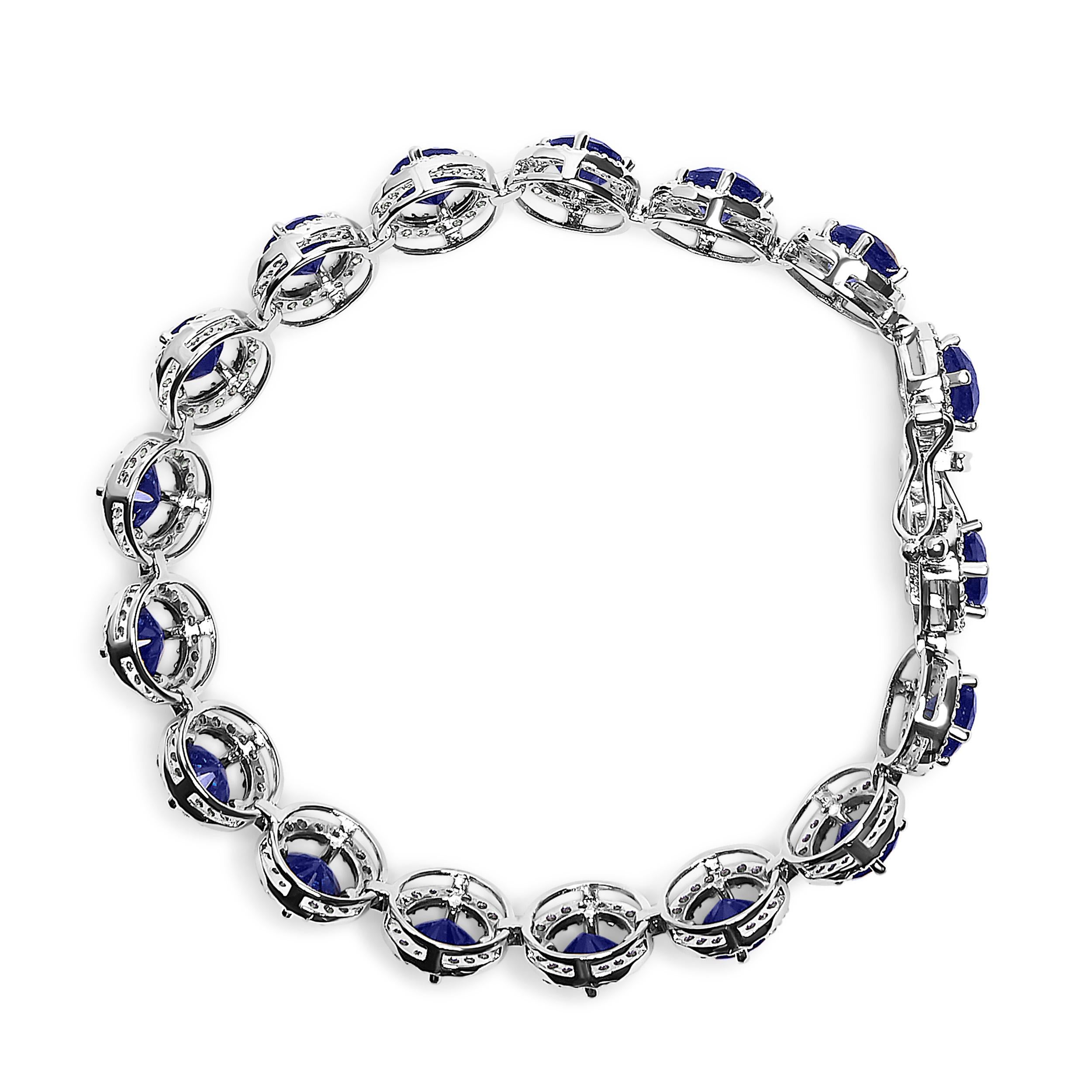 Contemporary Sterling Silver 21.0 Cttw Created Blue Sapphire & White Topaz Halo Link Bracelet For Sale