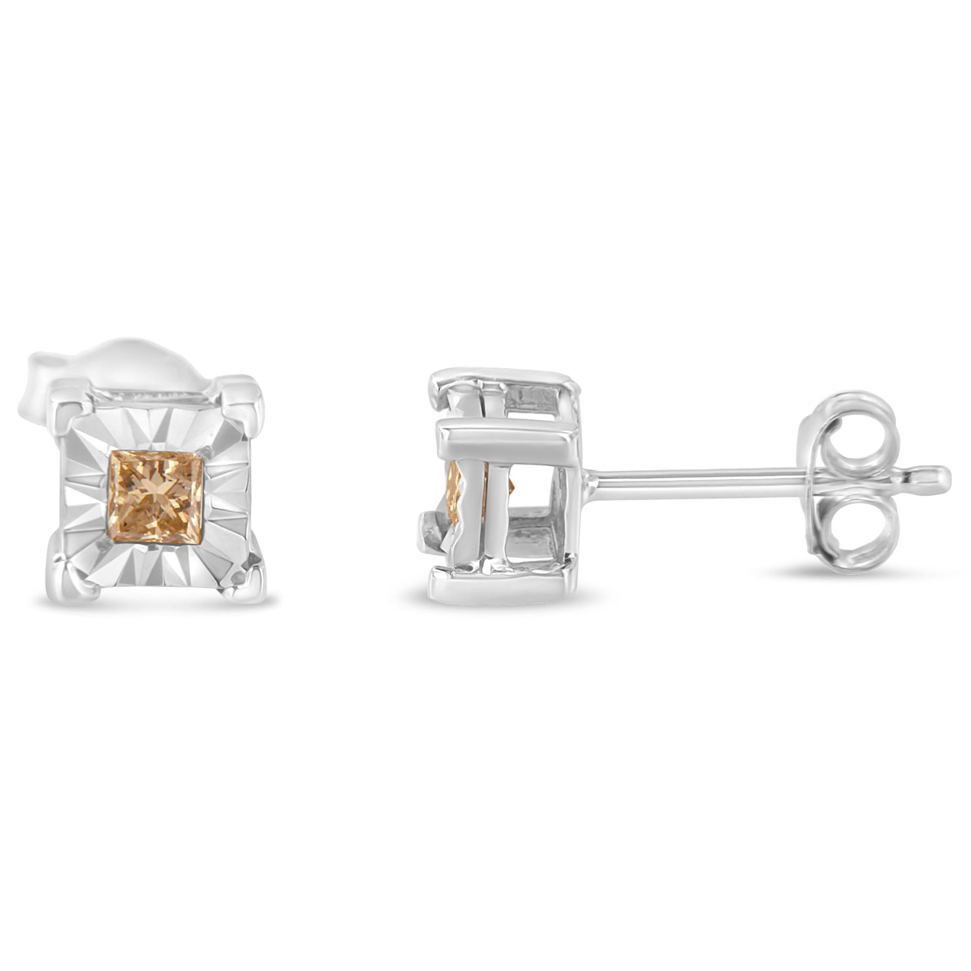 Two gorgeous white diamonds sit in a prong setting on these sparkling stud earrings. Crafted in sterling silver, these diamond stud earrings feature a high polish finish. These stunning silver earrings feature 3/8 carats of lovely champagne