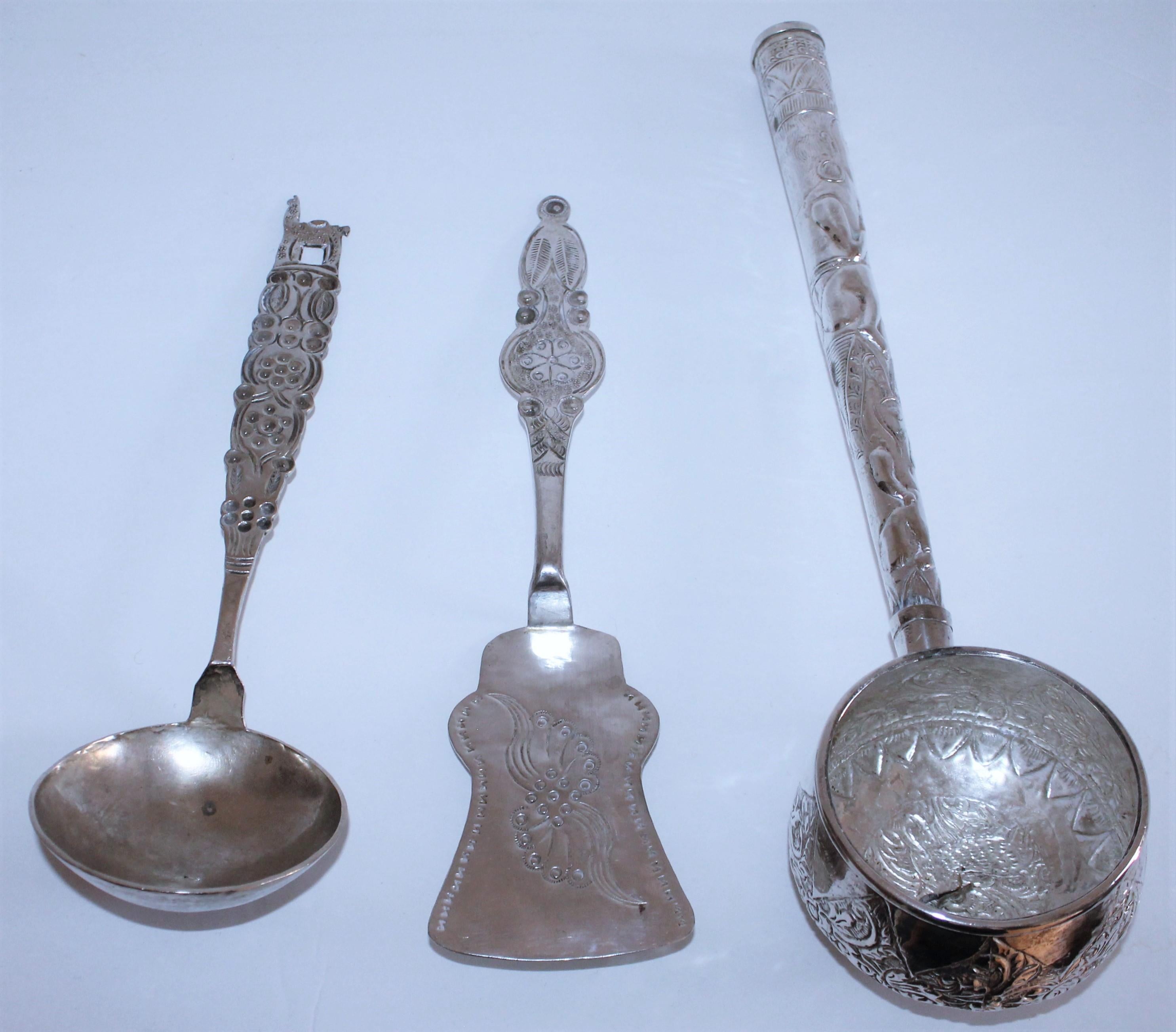 Handmade Peruvian three-piece sterling silver dipper and spatula and ladle. These are handmade and unmarked from the artist or maker.
Measurements from left to right:

Small spoon- 11 H x 3.5 W x 2.5 D
Spatula- 11.5 H x 2.75 W x 1.25 D
Large