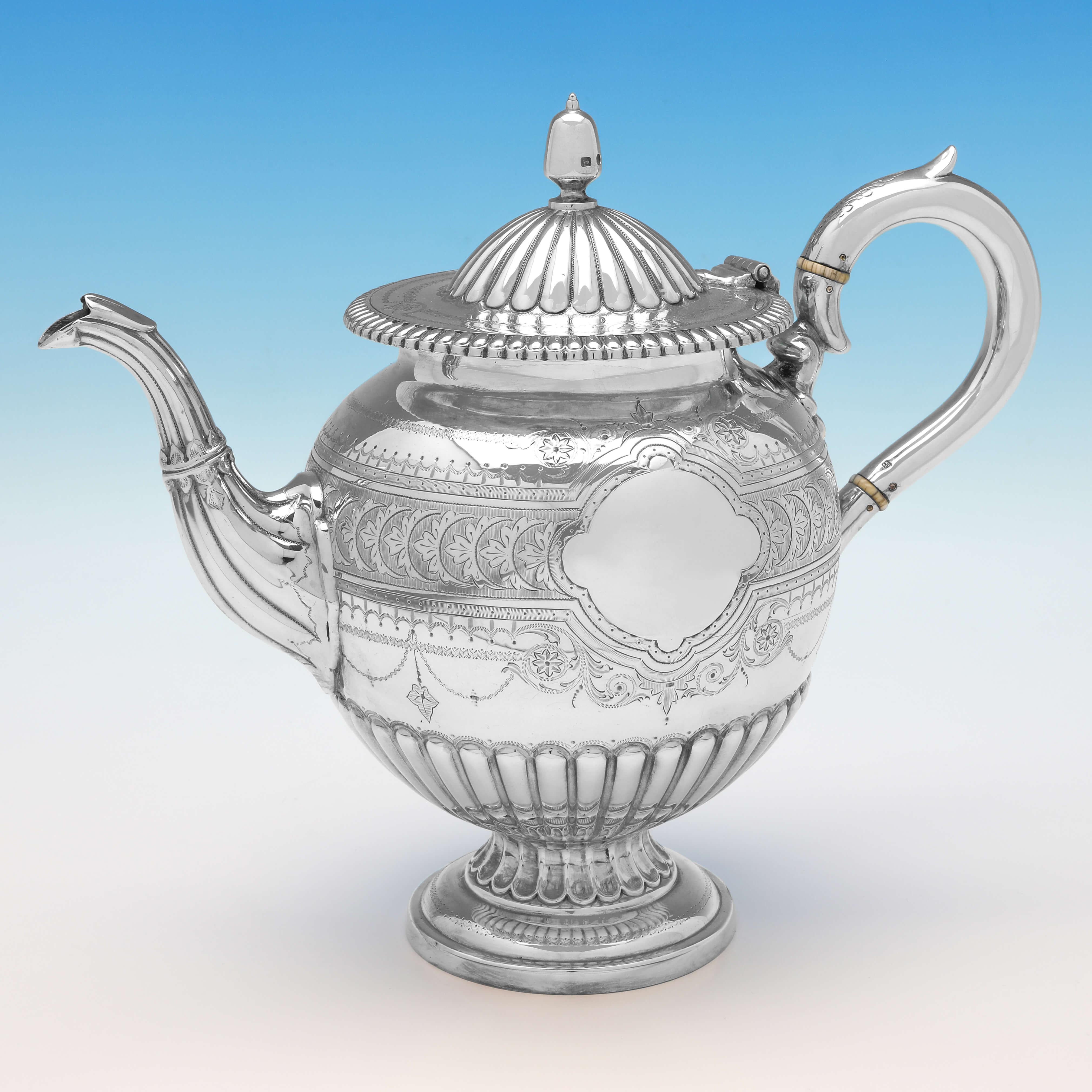 Hallmarked in Sheffield in 1876 by Roberts & Belk, this very attractive, Victorian, Antique Sterling Silver Tea Set, is 'Urn' shaped, and features wonderful engraved decoration throughout. The teapot measures 9.25