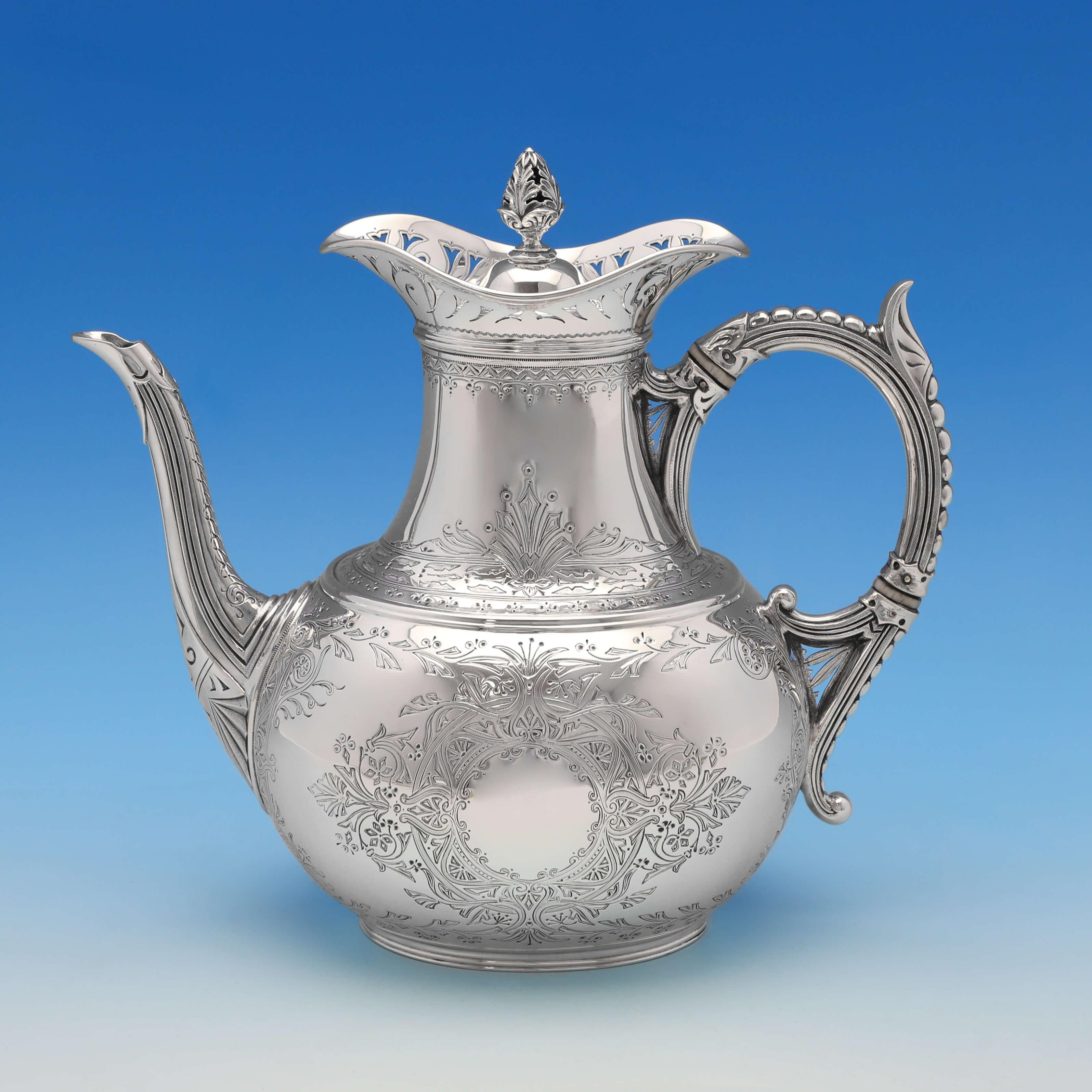 Hallmarked in London in 1888 by Elkington & Co., this very attractive, Victorian, antique sterling silver tea set, comprises a coffee pot, teapot, cream jug and sugar bowl, all featuring pierced borders to the top, striking engraved decoration, bead