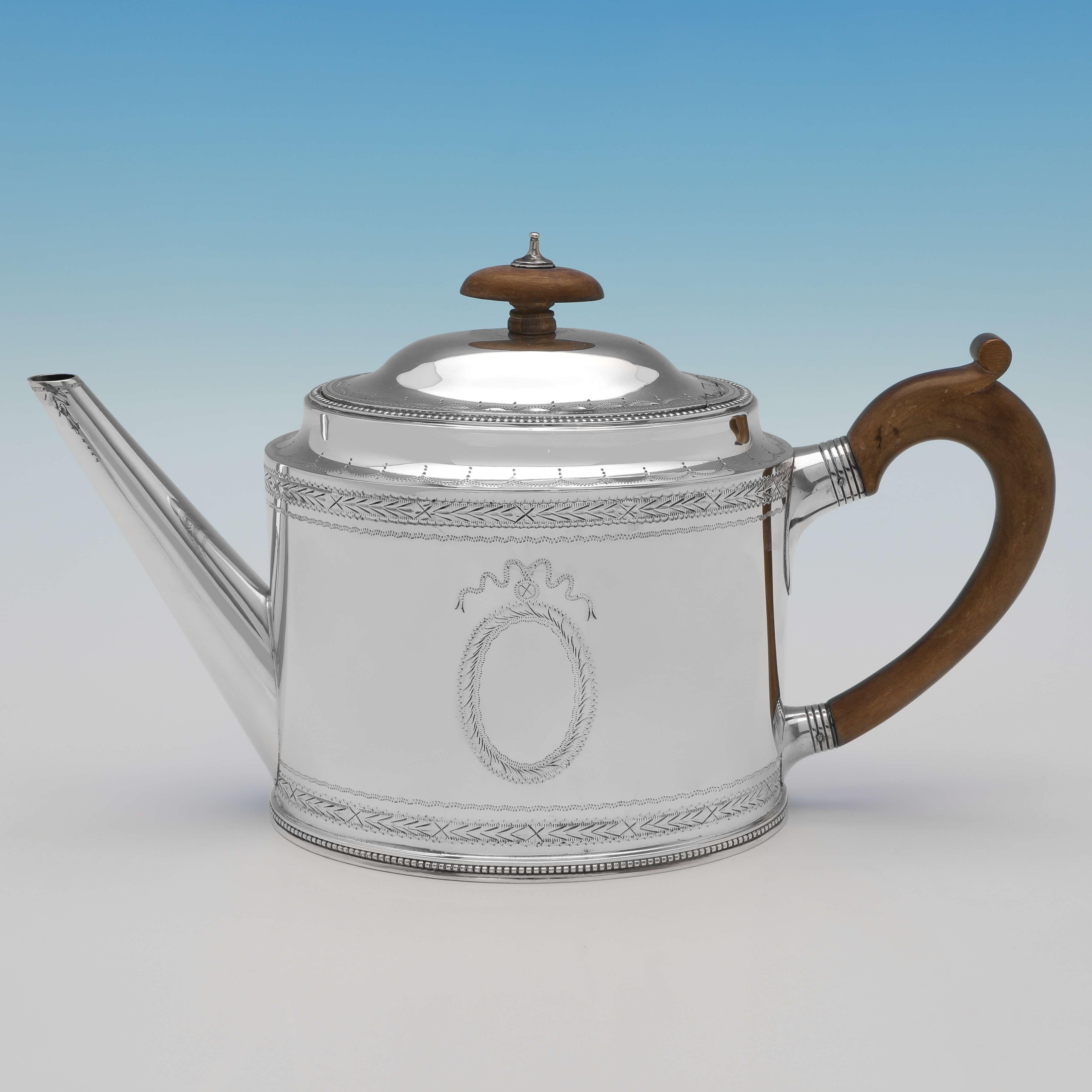 Hallmarked in London in 1962 by C. J. Vander, this handsome, 4 piece sterling silver tea set, is in the 'Hester Bateman' style. 

The teapot measures 6