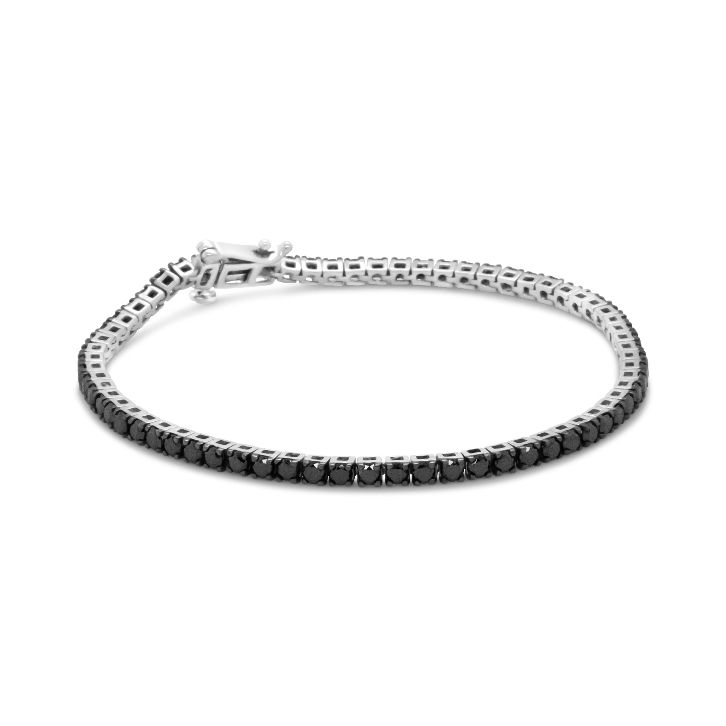 Elegant and timeless, this gorgeous .925 sterling tennis bracelet features 4.0 carat total weight of natural round brilliant cut treated black diamonds with a whopping 66 individual stones in all. The tennis bracelet has hinged links consisting of a