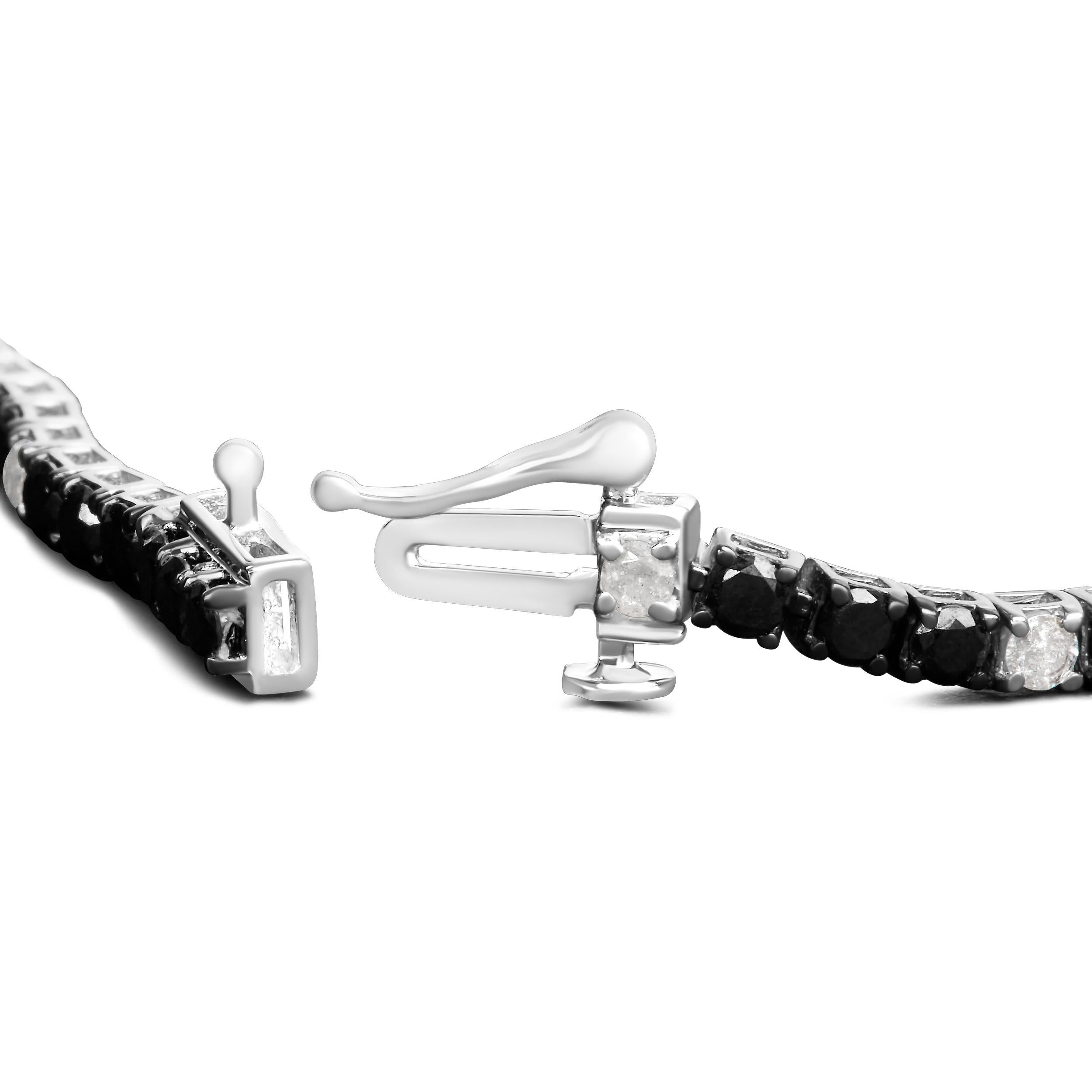 Step into a world of timeless elegance and unrivaled sophistication with this stunning bracelet. Exquisitely crafted from .925 sterling silver and polished with a radiant rhodium plating, this masterpiece resonates with a luminous brilliance that