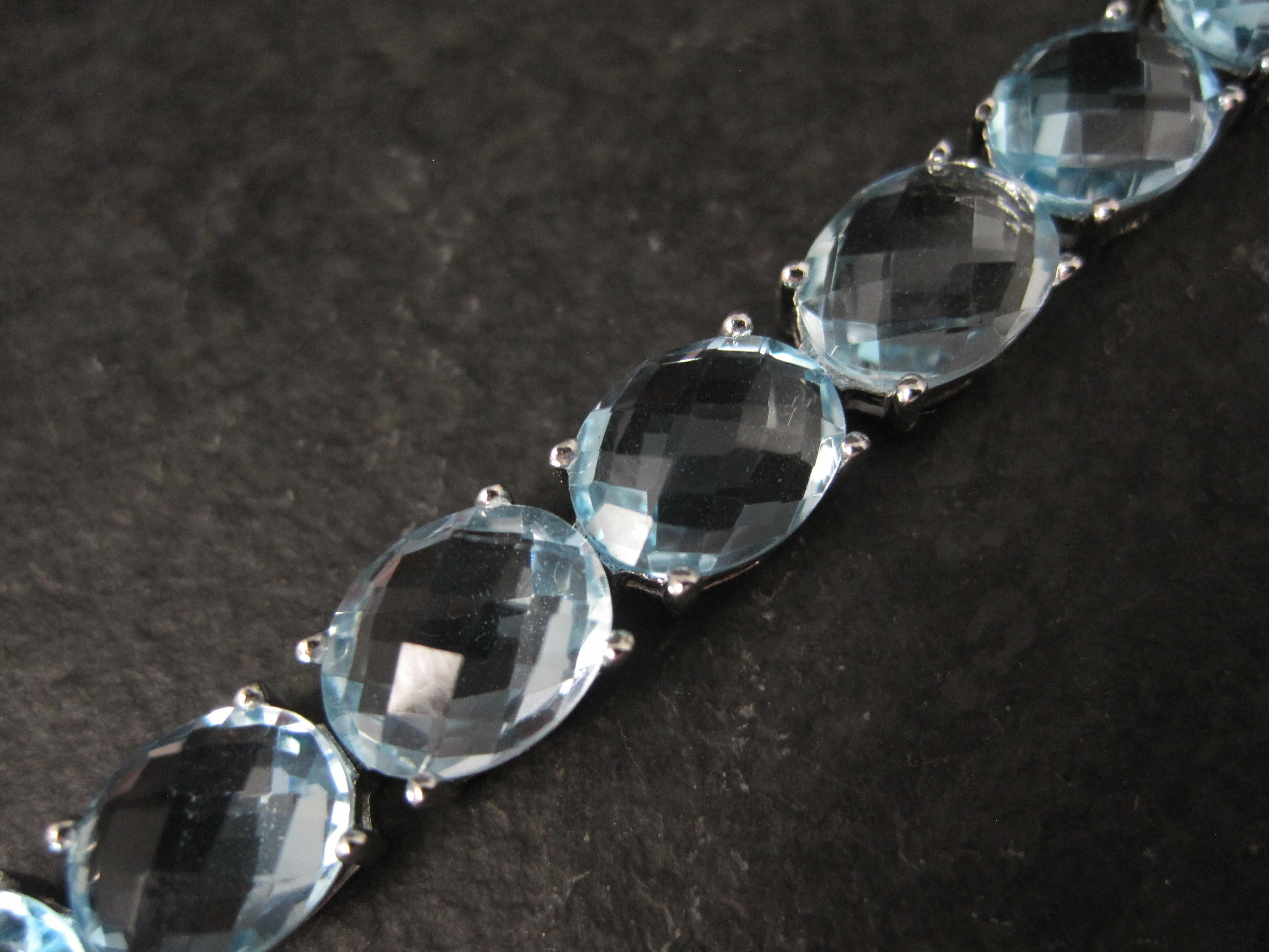 Pulsera de tenis de plata de ley con topacio azul de 45,6 quilates en venta 1