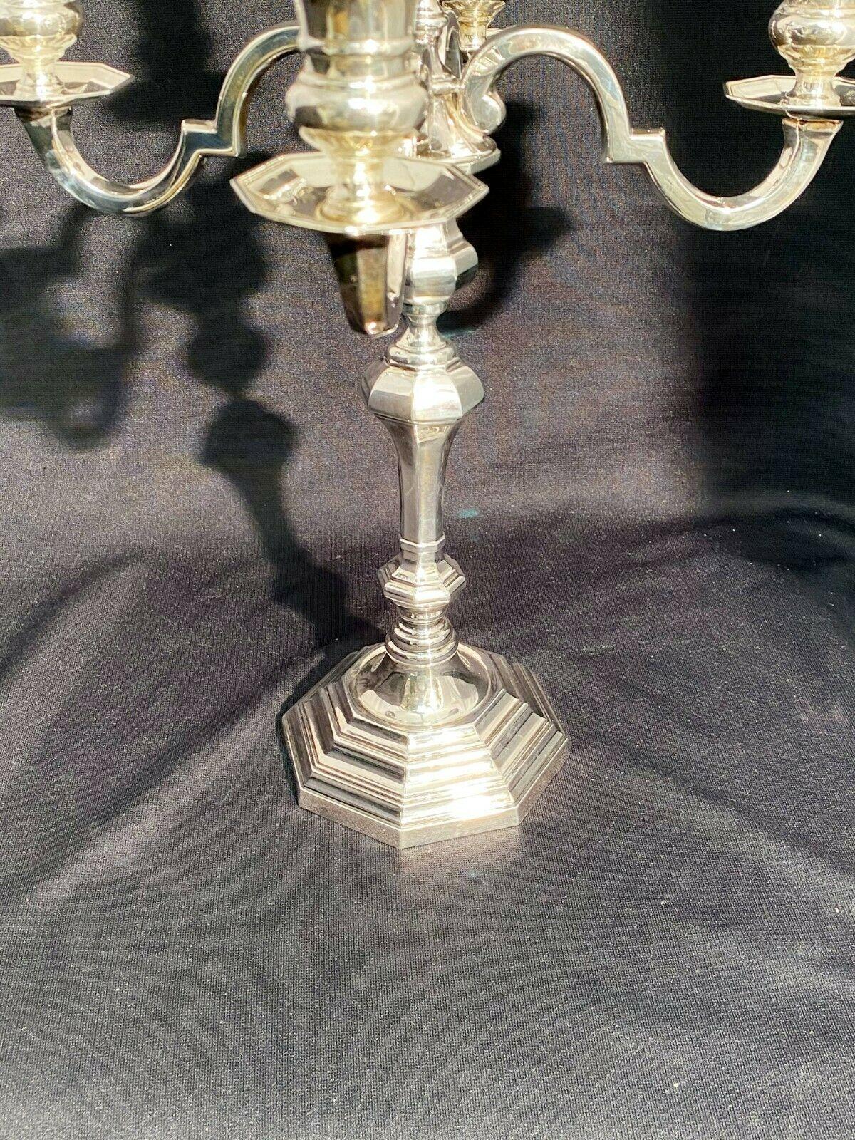 Sterling silver 5 light candelabra by the famous Italian silversmith Pampaloni in desirable Art Deco style. Measures 16 inches tall and 12 inches across. Weighted but gross weight is 36.8 troy oz. Bearing hallmarks as shown.

Pampaloni is a