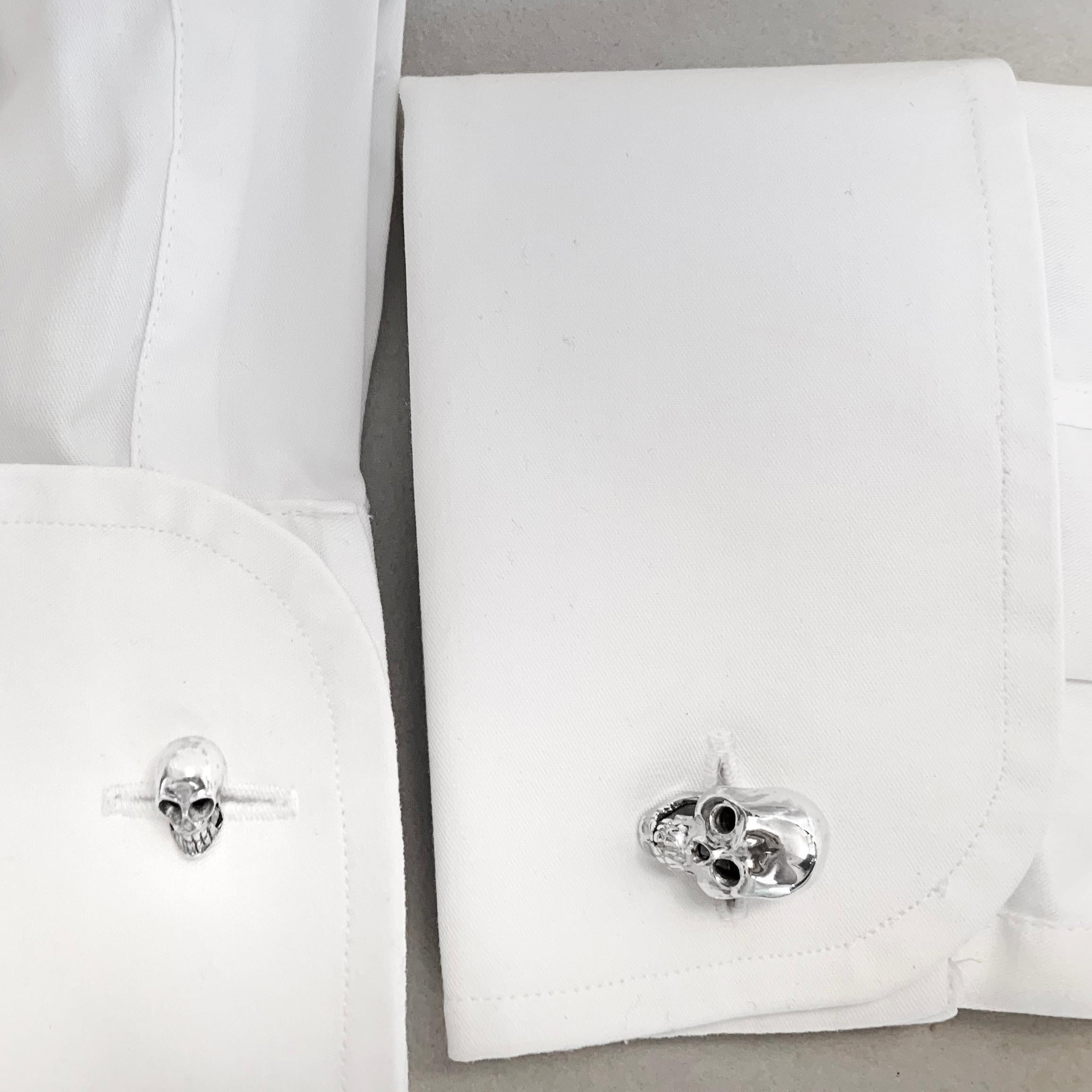 This pair of cufflinks is entirely made in sterling silver 925, featuring two skulls bigger and as a post two skulls smaller.

All AVGVSTA jewelry is new and has never been previously owned or worn.  
Each item will arrive beautifully gift wrapped