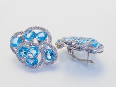 Sterling Silver 9.64ct Oval Blue Topaz & White Quartz Floral Earrings