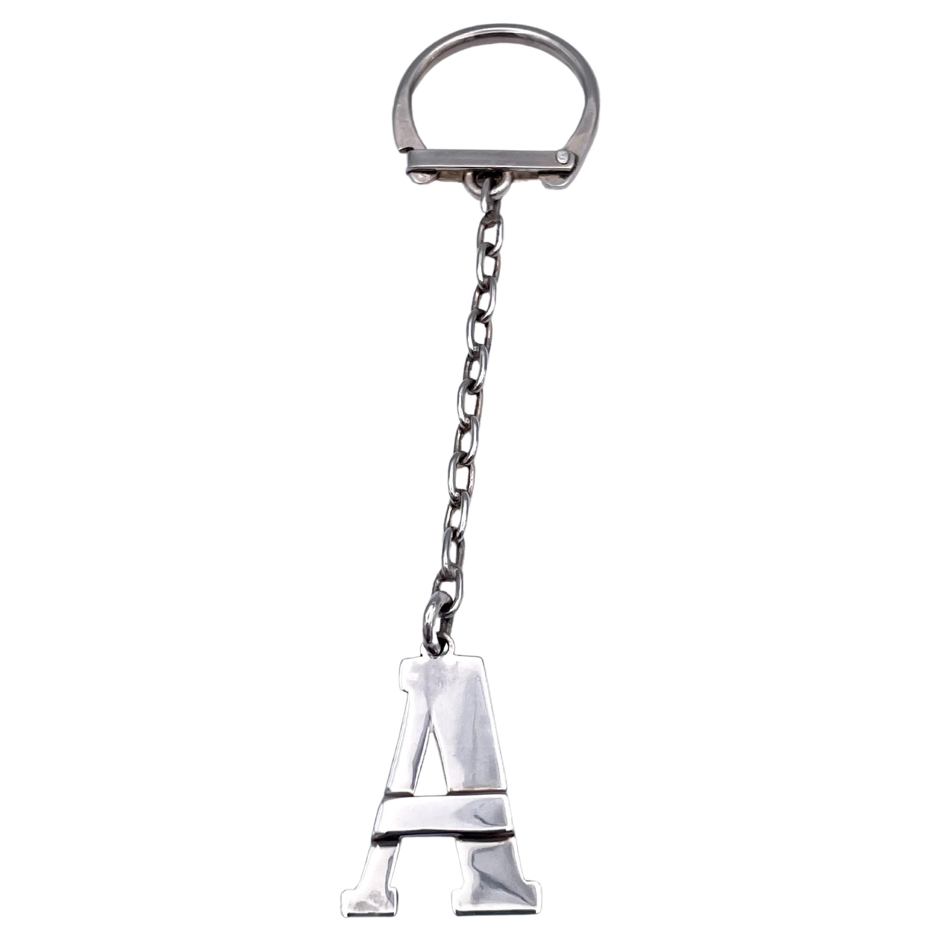 Sterling silver key chain.  Set with a bold Capital 
