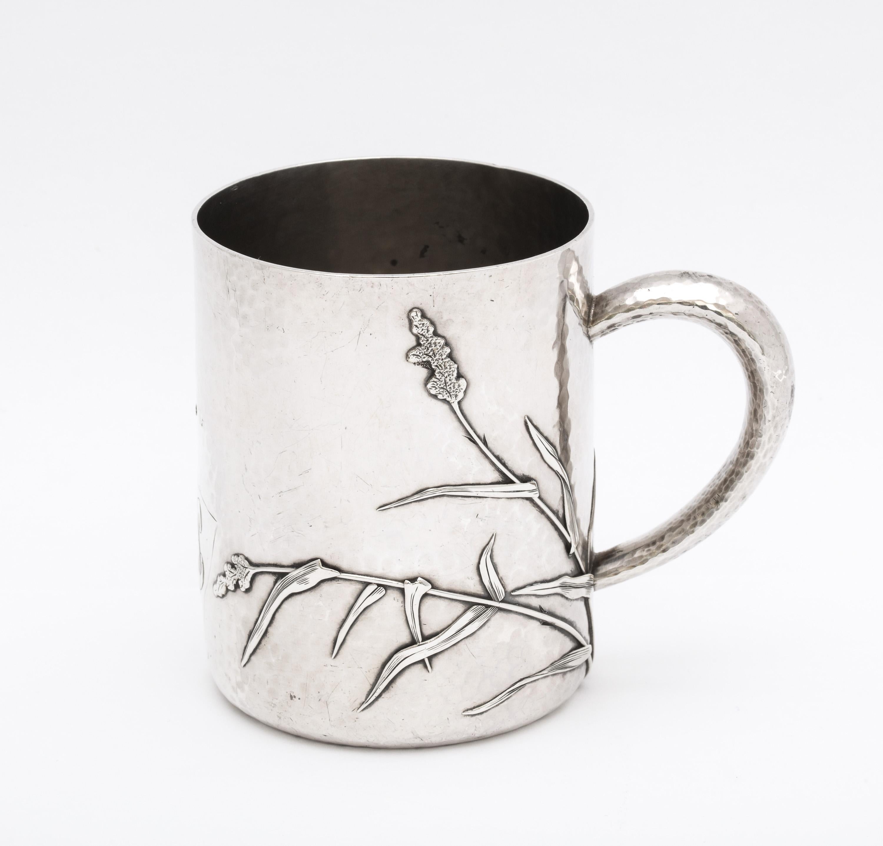 Sterling silver. Aesthetic Movement cup/mug, Providence, Rhode Island, Ca. 1870's, Whiting Manufacturing Co. - makers. Decorated with dragonflies; lightly hammered. Has a script monogram. Measures 3 1/4 inches high x 2 3/4 inches diameter x 3 3/4