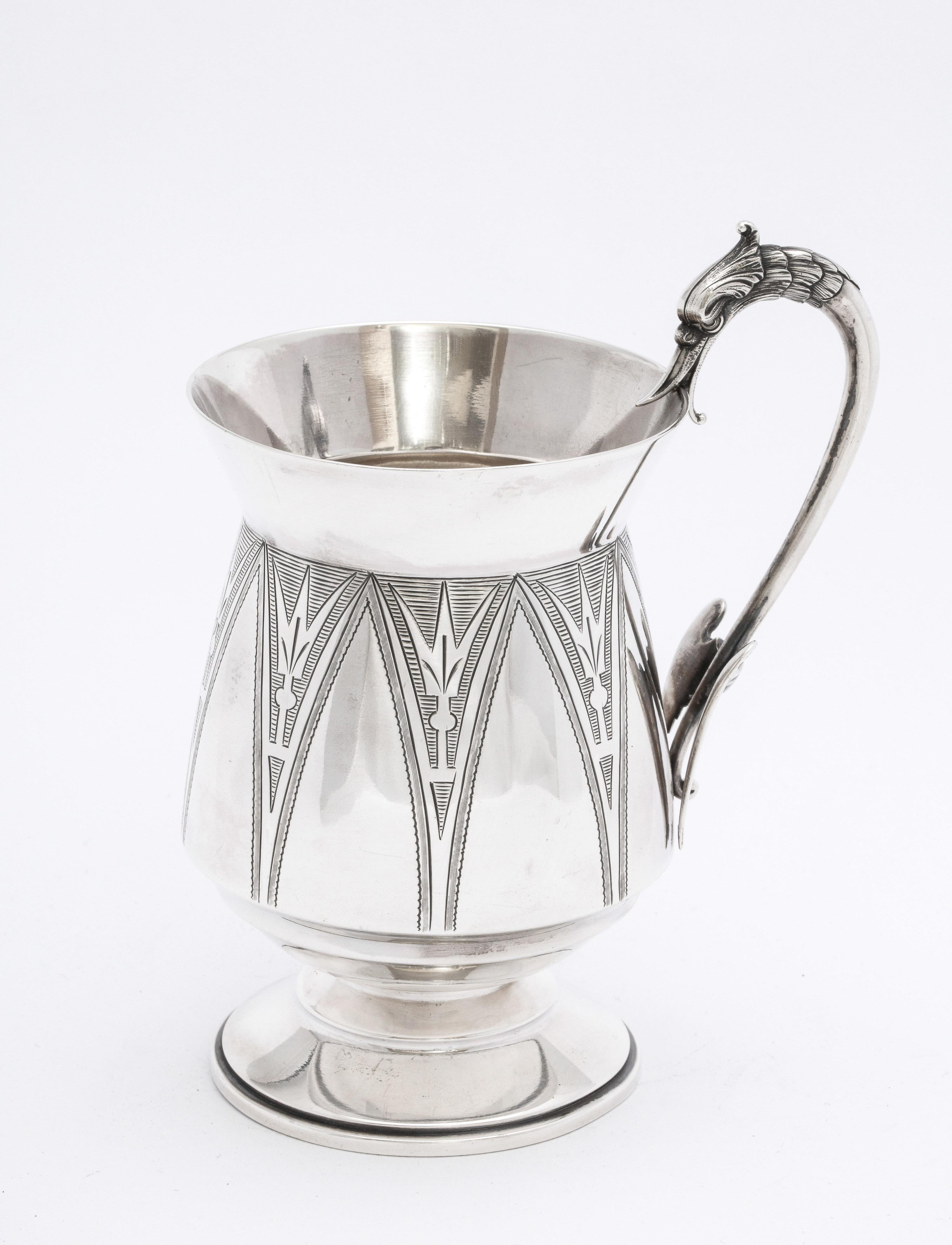 Sterling silver Aesthetic Movement mug/cup on pedestal base, New York, Ca. 1875, Wood and Hughes - makers. Lovely etched designs on mug. Handle is in the form of a swan (its long neck being the hand-hold) holding the top of the cup in its mouth. The