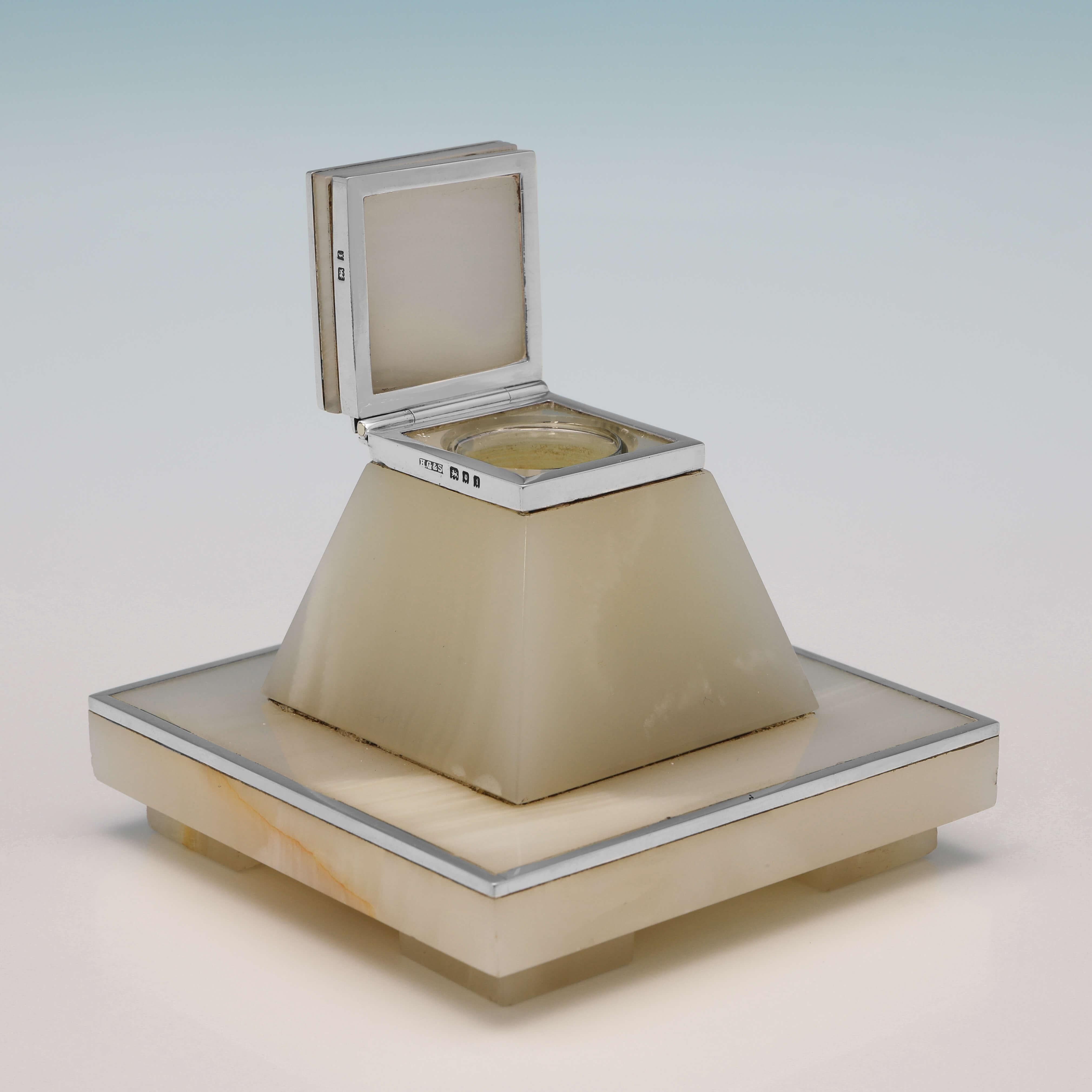 Hallmarked in London in 1921 by Henry Griffith & Sons Ltd., this very handsome, Antique Sterling Silver Ink Stand, is in the Art Deco taste, and is made from Alabaster with silver mounts. The ink stand measures 2.75