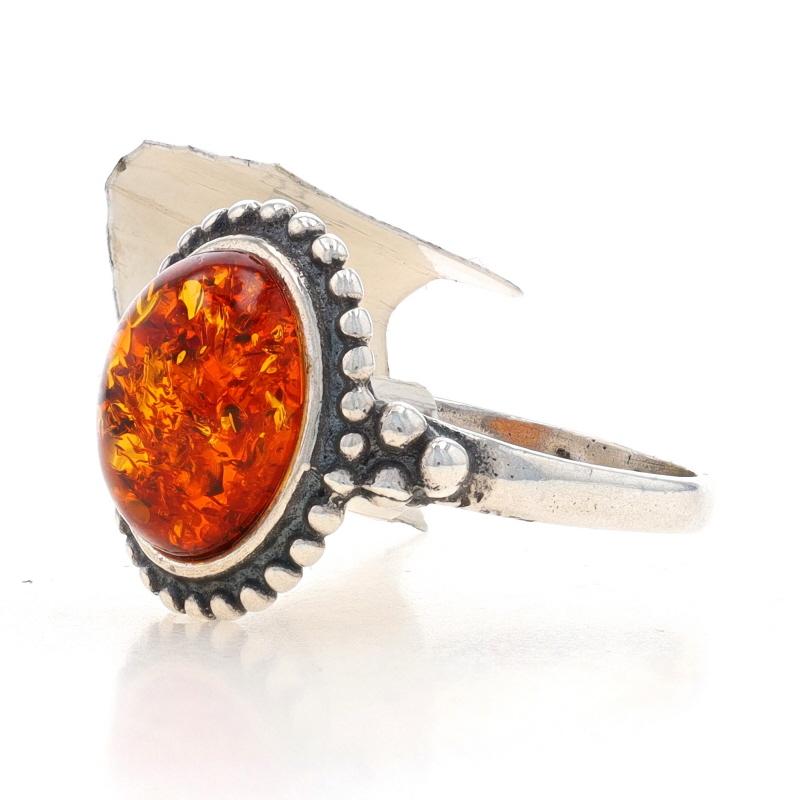 Size: 5 3/4
Sizing Fee: Up 2 sizes for $20 or Down 2 sizes for $20

Metal Content: Sterling Silver

Stone Information

Natural Amber
Cut: Oval Cabochon
Color: Orange

Style: Cocktail Solitaire

Measurements

Face Height (north to south): 9/16