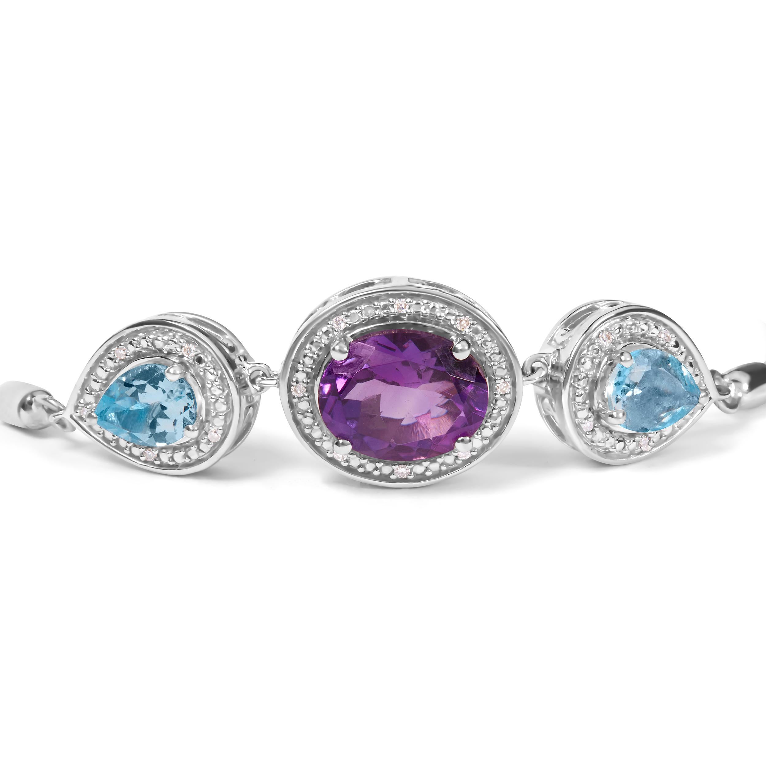 This .925 Sterling Silver Lariat Bolo Bracelet is a luxurious piece that's perfect for any occasion. Adorned with three stunning gemstones, including a dazzling 10x8mm oval-cut purple amethyst and two pear-cut blue topaz, this bracelet is the