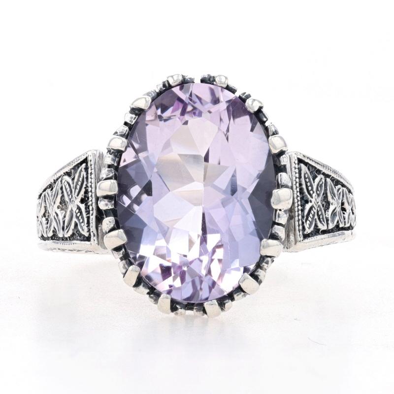 Size: 8
Sizing Fee: Up 1 size for $30

Metal Content: 925 Sterling Silver

Stone Information

Natural Amethyst
Carat(s): 6.50ct
Cut: Oval
Color: Light Purple

Total Carats: 6.50ct

Style: Cocktail Solitaire 
Theme: Floral 
Features:  Etched &