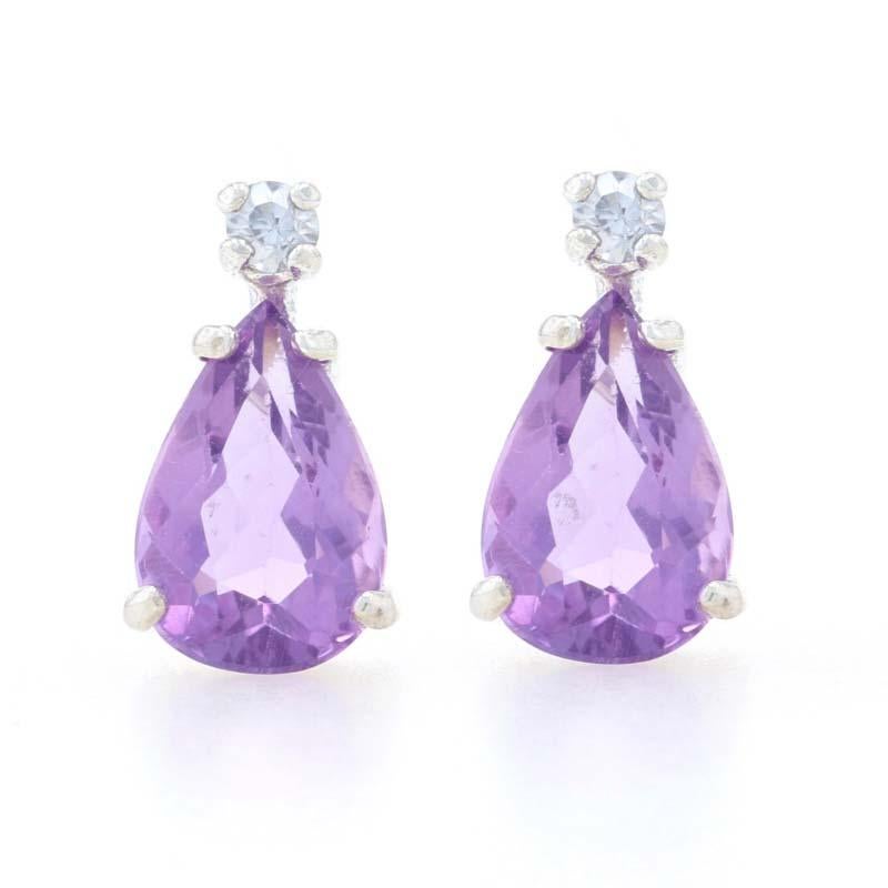 Metal Content: 925 Sterling Silver

Stone Information
Genuine Amethysts
Carats: 3.40ctw
Cut: Pear
Color: Purple

Cubic Zirconias
Carats: .14ctw dew
Cut: Round Brilliant
Color: Clear

Style: Stud 
Fastening Type: Butterfly