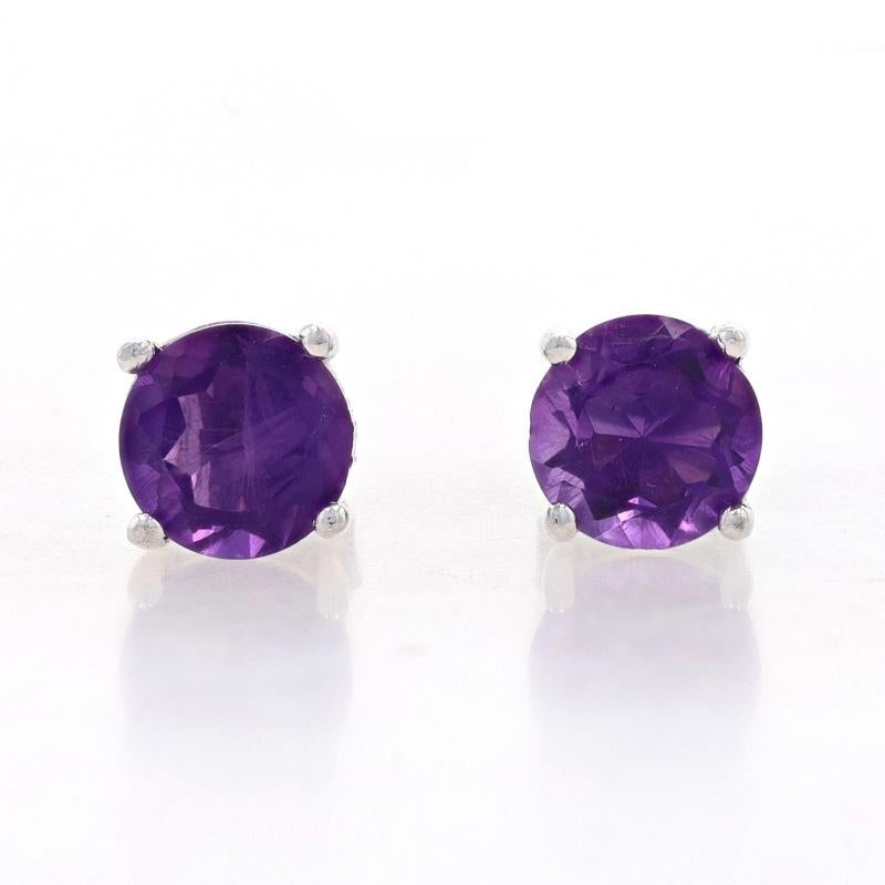 Metal Content: Sterling Silver

Stone Information

Natural Amethysts
Carat(s): 2.60ctw
Cut: Round
Color: Purple
Diameter: 7mm

Total Carats: 2.60ctw

Style: Stud
Fastening Type: Butterfly Closures

Measurements

Diameter: 9/32