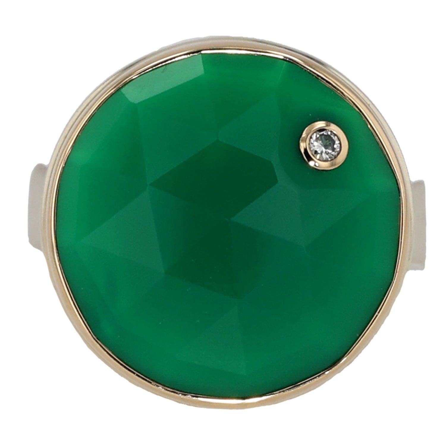 Elevate your jewelry collection with this exquisite Sterling Silver and 14K Gold Ring by Jamie Joseph. Featuring a stunning round rose-cut green onyx, the ring captures the essence of nature's beauty with its vivid, deep green hue. The green onyx is
