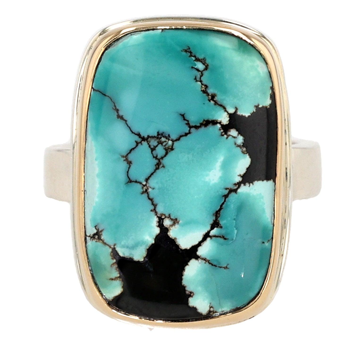 Discover the perfect fusion of contemporary design and timeless elegance with this Sterling Silver and 14K Gold Ring by Jamie Joseph. Showcasing a mesmerizing vertical rectangular Hubei Turquoise set on a unique Y band, this ring is a standout