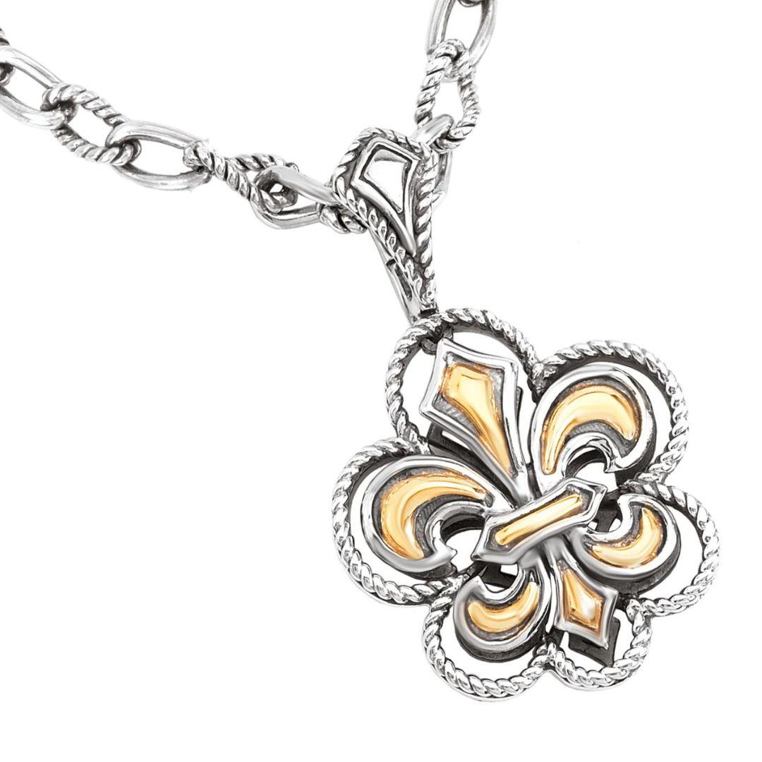 Elegant Fleur De Lis Pendant in Sterling Silver and rich 18k Yellow Gold. Delicate milgrain design gives this classic pendant a touch of antique royal flair. Chain is 18 inches long with a lobster claw.